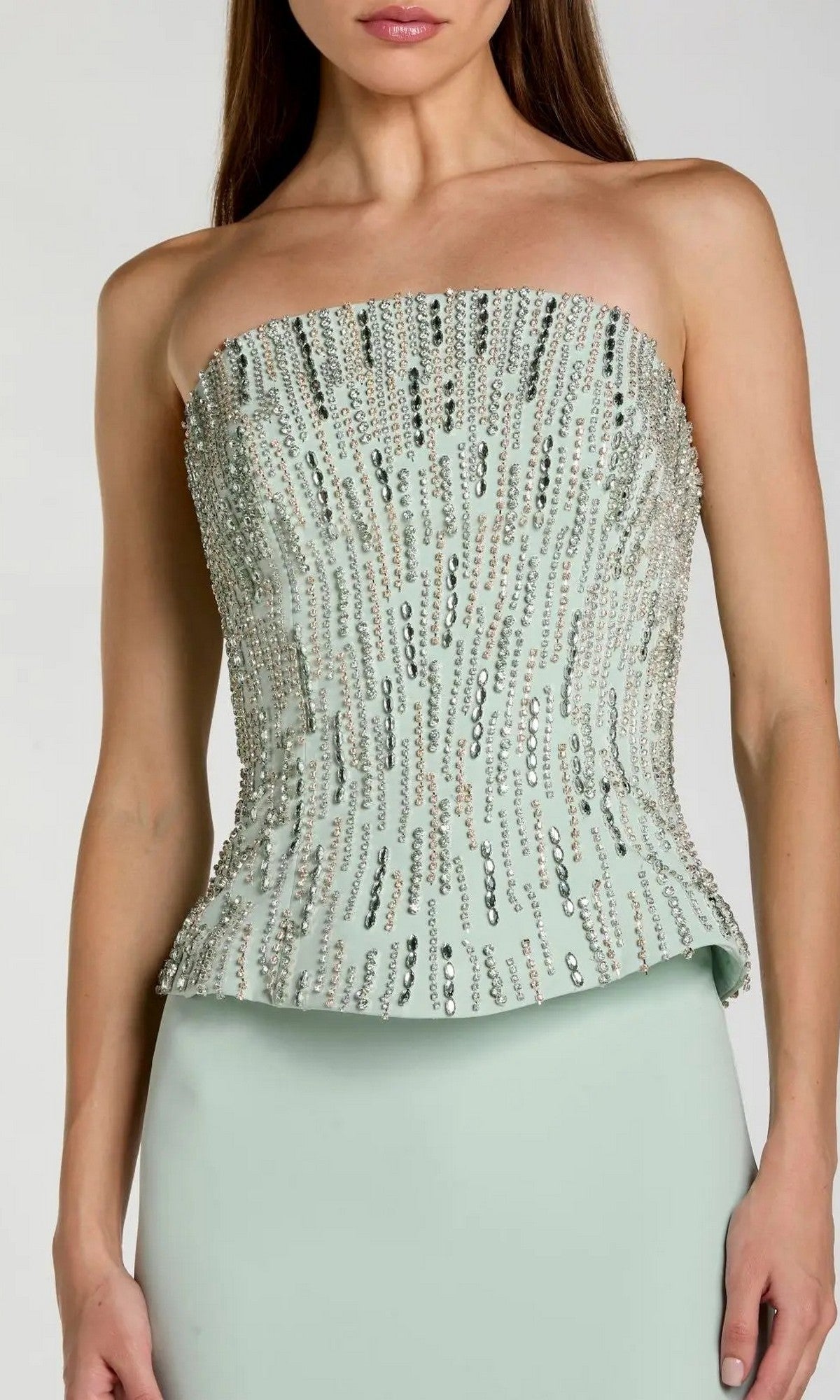 A woman wearing the Mac Duggal 2366 long formal dress—a strapless, light green gown featuring vertical rows of sequins, reminiscent of a mint-colored, elegant ensemble.