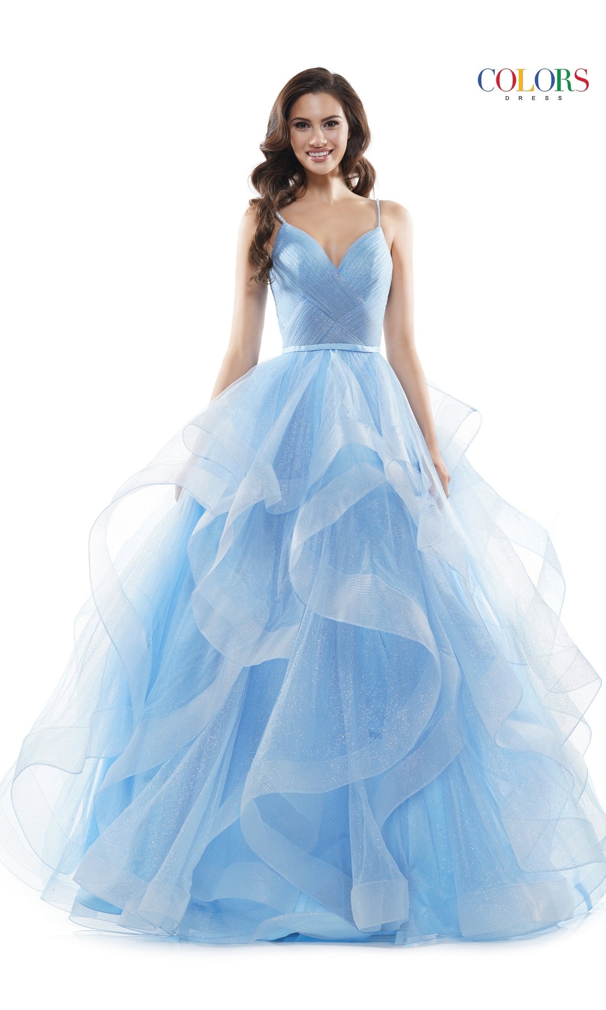 A woman wears the Layered Long Tulle Prom Ball Gown 2381—light blue with a fitted bodice and ruffled, voluminous skirt—standing against a plain white background.