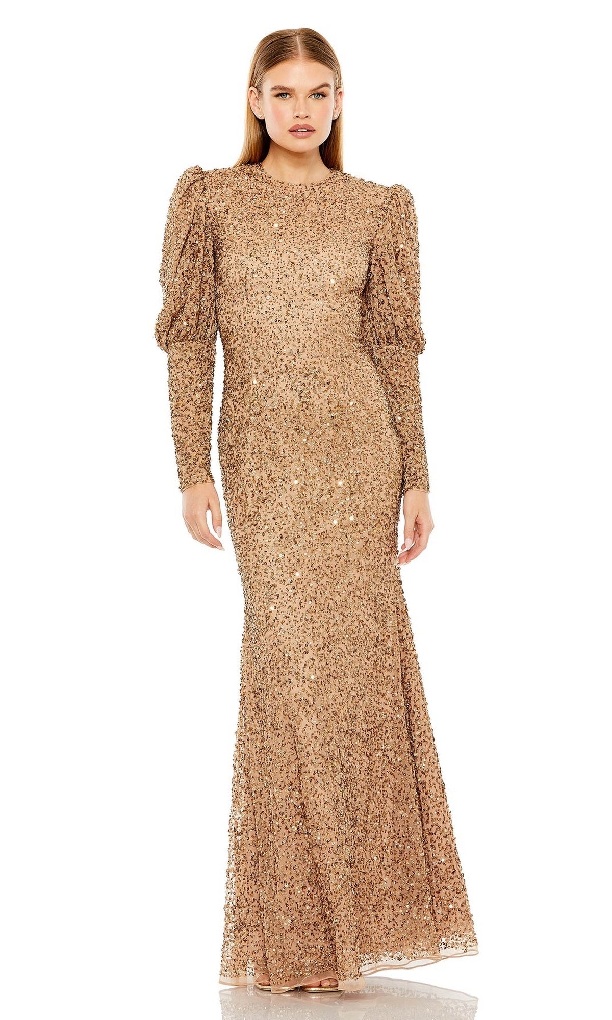 A woman models the Long Formal Dress 24000 by Mac Duggal—a gold sequin, long-sleeve gown with slight puff shoulders, high neck, and fitted silhouette—against a plain white background.