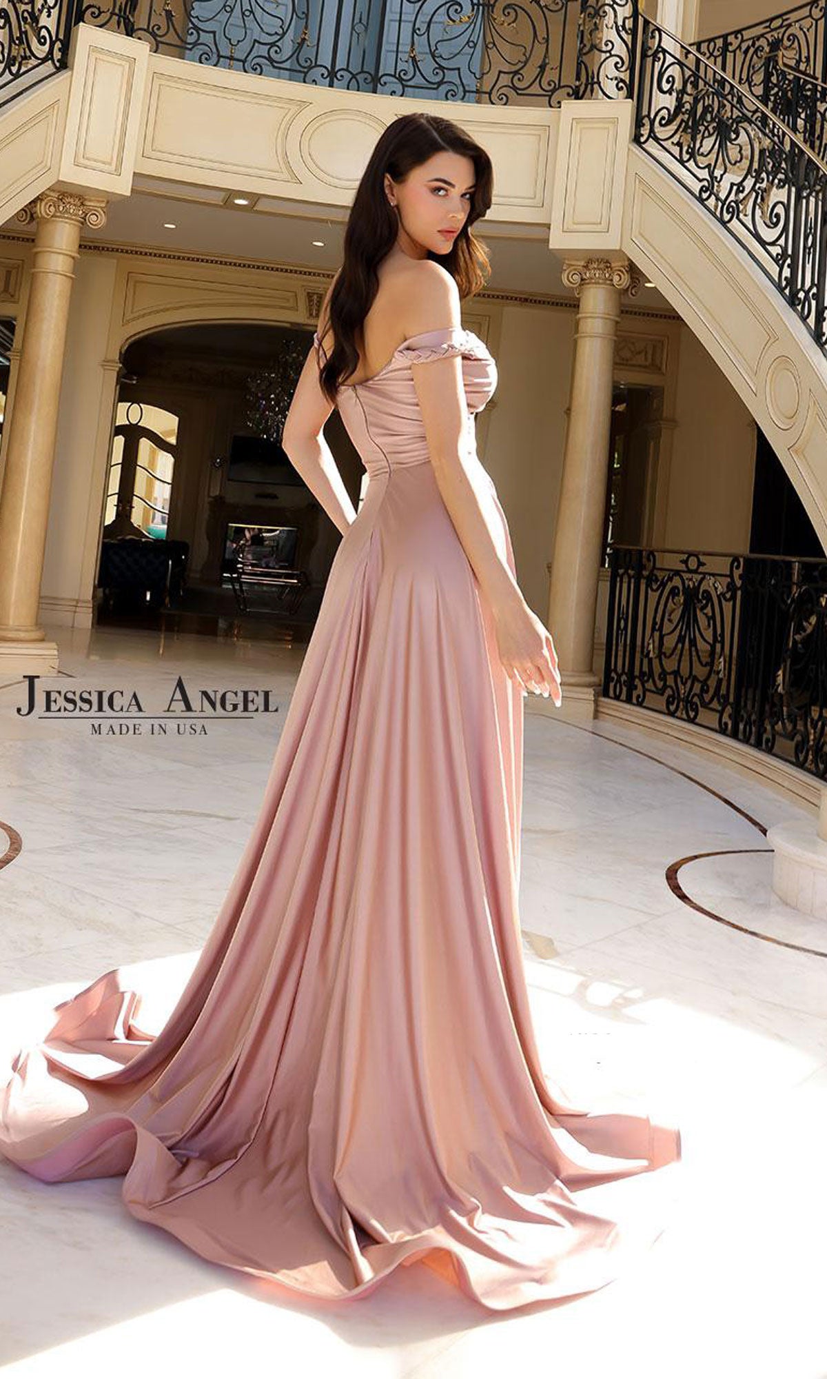 A woman wears the Classic A-Line Long Prom Dress: Jessica Angel 2409, standing in an elegant foyer with marble floors and ornate iron railings.