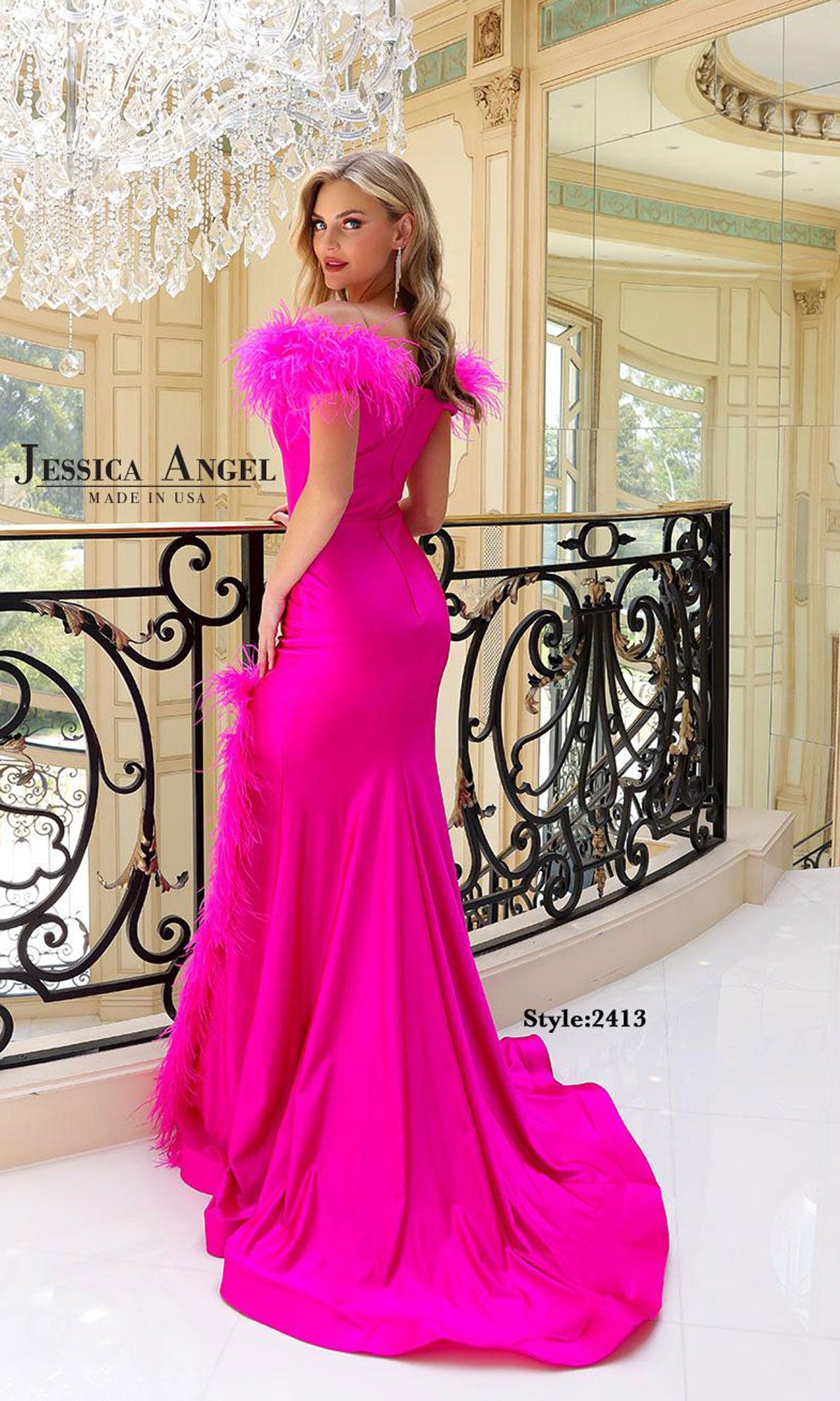 A woman in the Jessica Angel 2413 Feather-Sleeve Long Prom Dress stands on an ornate balcony inside a sunlit, elegant interior.