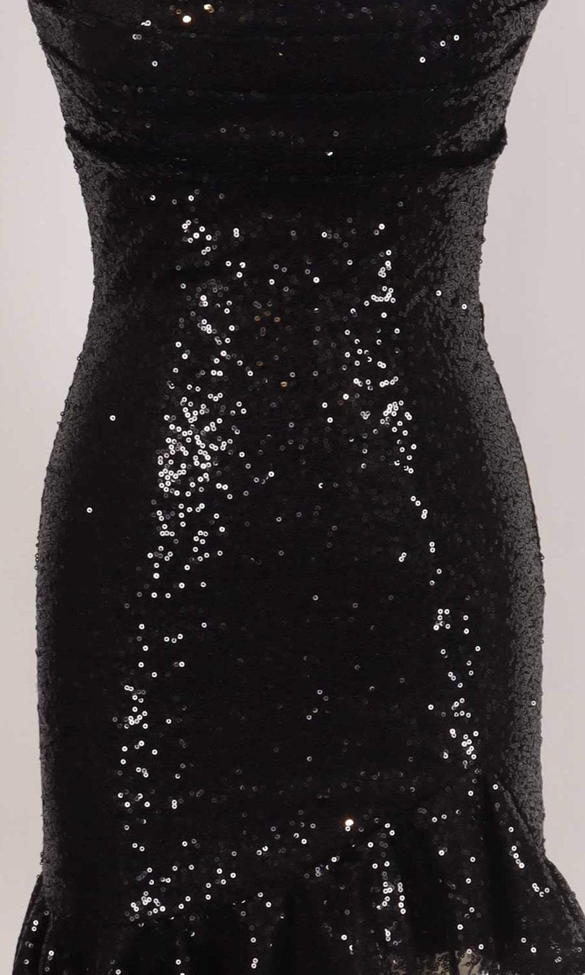 Closeup view of a black sequin dress fabric.