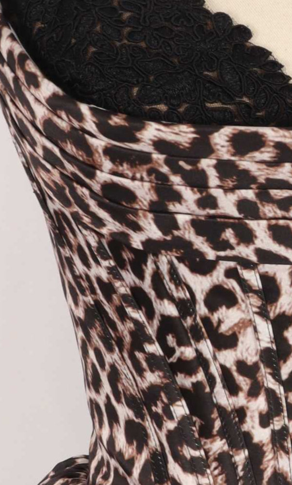 Close-up of the PromGirl Exclusive 250181 print homecoming dress corset, featuring leopard-print fabric and visible stitching, styled over black lace.