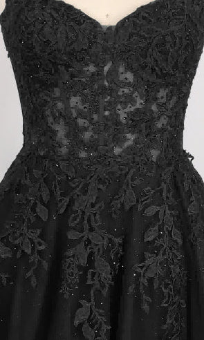 A close-up of the Long Prom Dress: PromGirl Exclusive 250268, a black strapless gown with a sheer corset bodice and delicate floral lace embroidery on the bodice and upper skirt.
