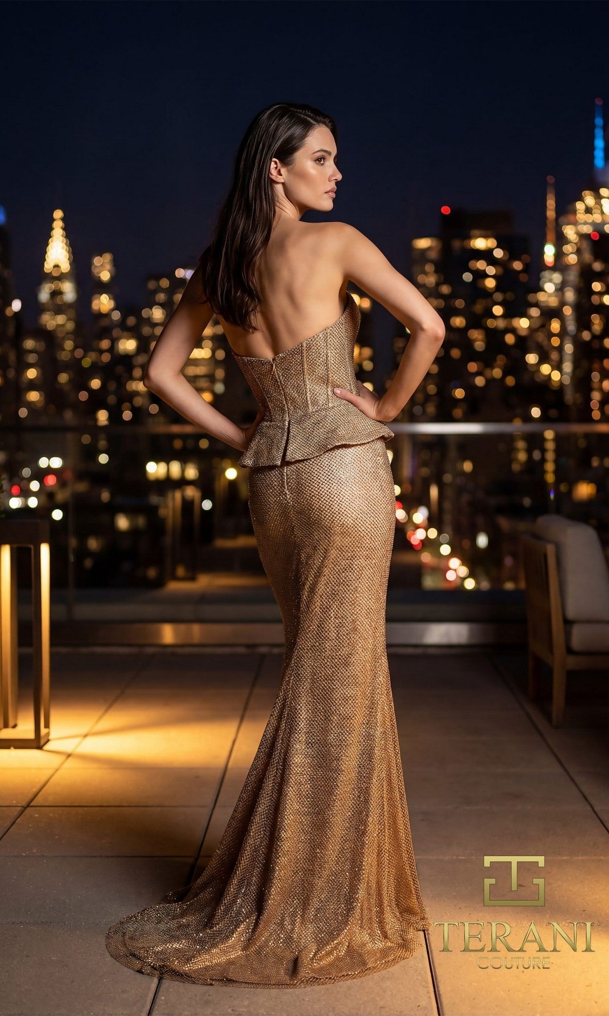 A woman in the Terani 261E6570 long formal dress stands on a rooftop terrace at night, with a city skyline in the background.