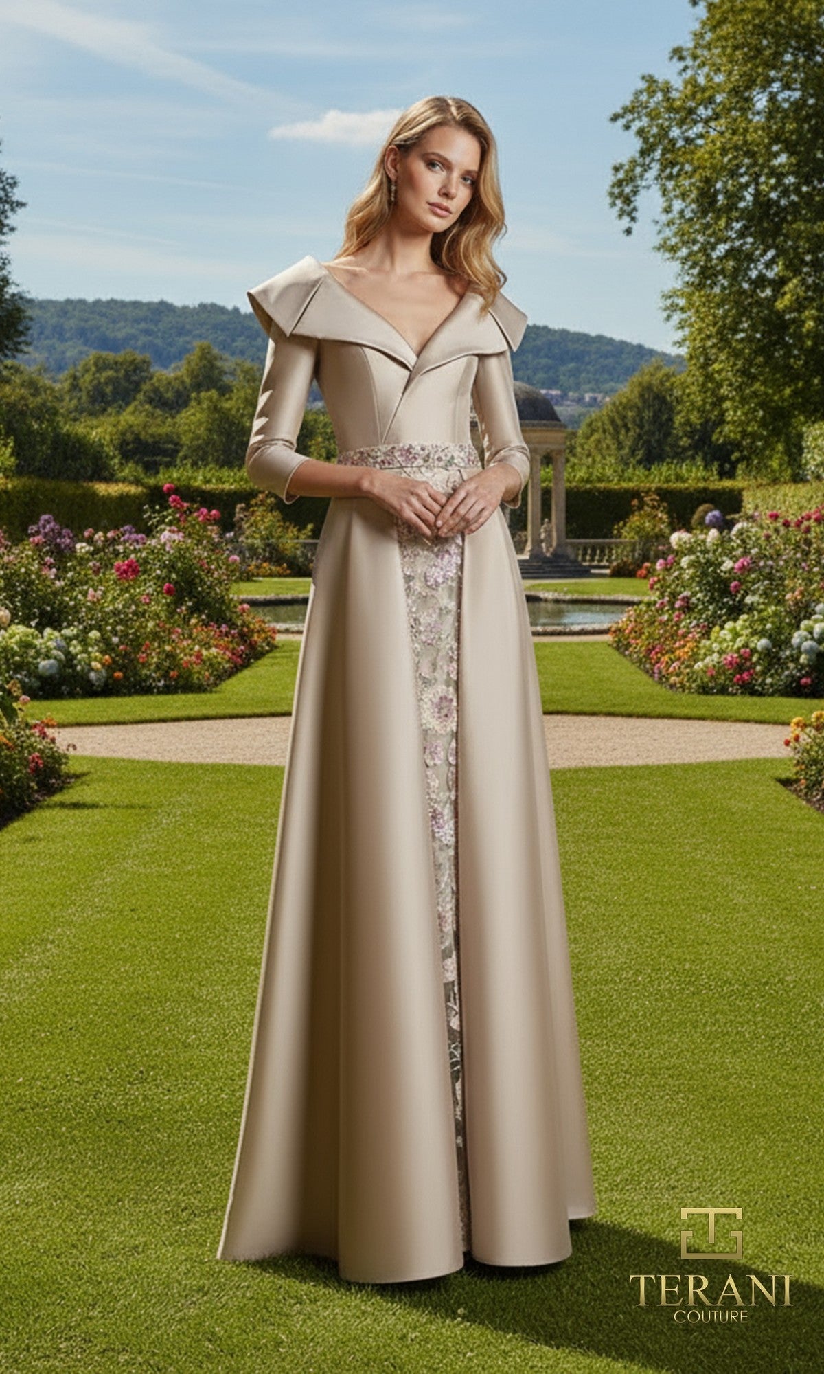 A woman stands in a formal garden wearing the Terani 261M6455 long formal dress, featuring a structured collar and floral panel.