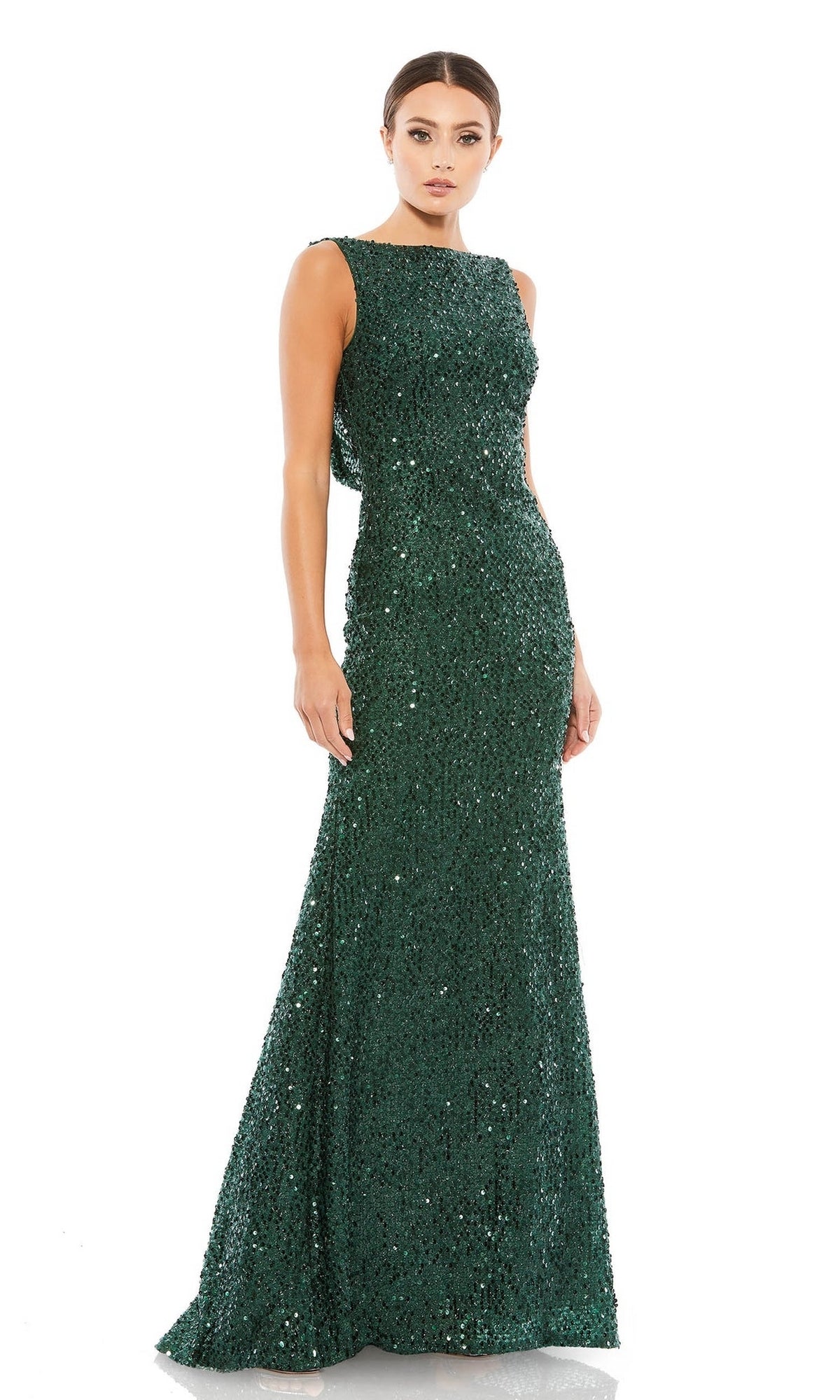 A woman wearing the Mac Duggal 26331 Cowl-Back Long Sequin Prom Dress stands against a plain white background.