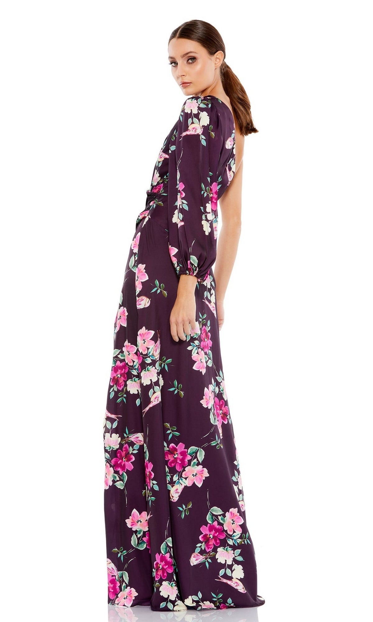 A woman models the Mac Duggal 2634 Plum Floral Long Formal Dress, featuring elegant pink and white accents, against a white background.