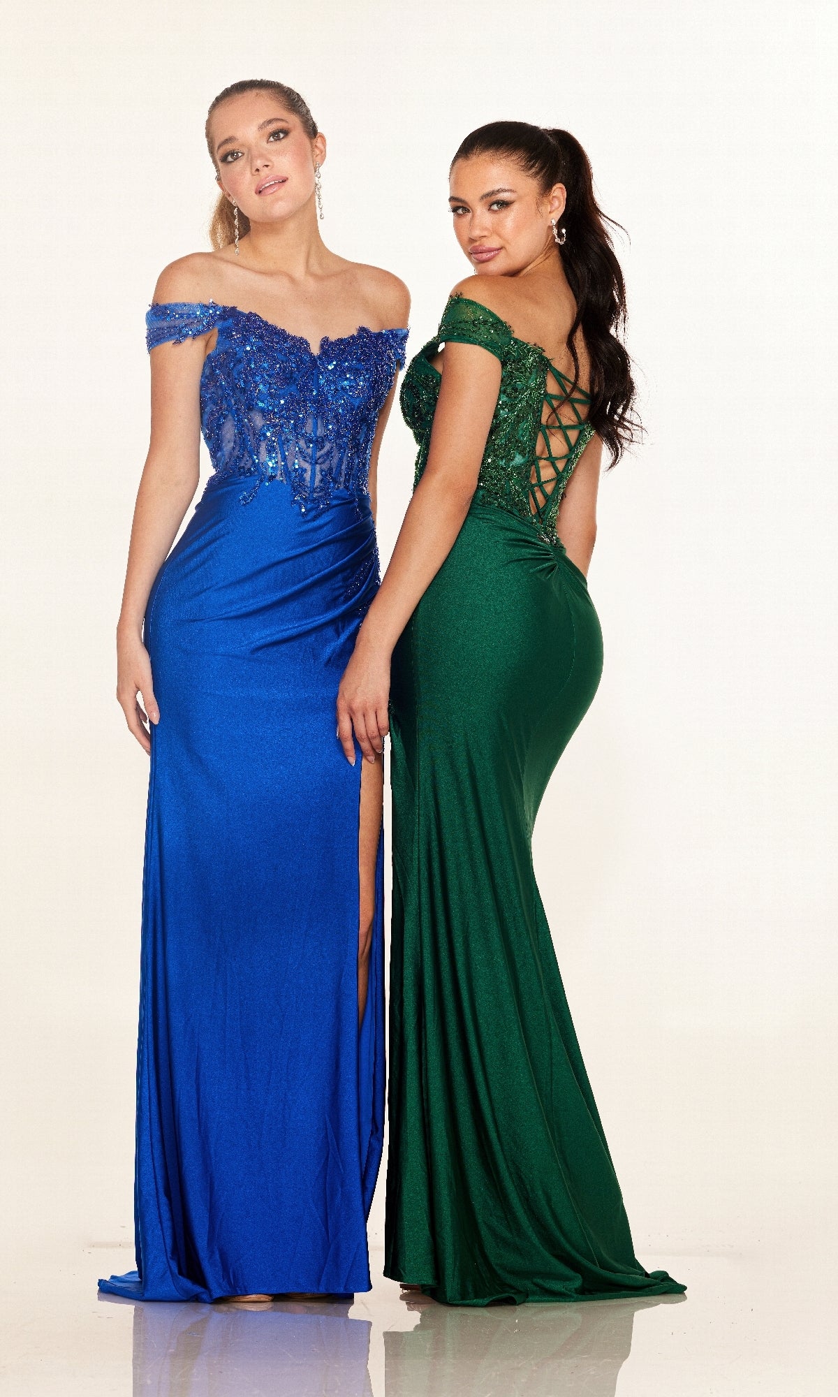 Two women wear the Cecilia Couture 2645 long prom dress—one in blue with a thigh-high slit, the other in green with an elegant lace-up back.