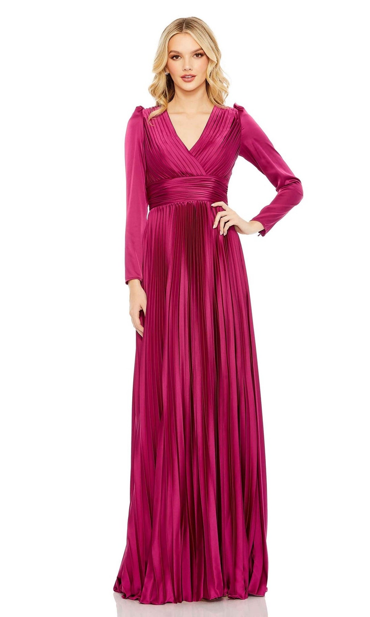 A woman faces forward wearing the Long Formal Dress 26542 by Mac Duggal, featuring magenta pleats, long sleeves, a V-neckline, and a floor-length skirt.