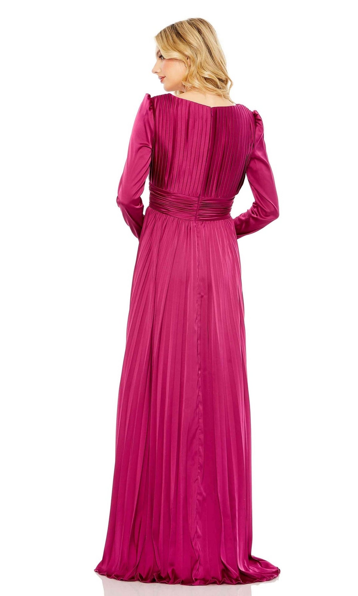 A woman with blonde hair faces away, wearing the Long Formal Dress 26542 by Mac Duggal—a magenta satin gown with a v-neckline, long sleeves, and elegant pleating on the upper back and skirt. The dress is floor-length and formal.