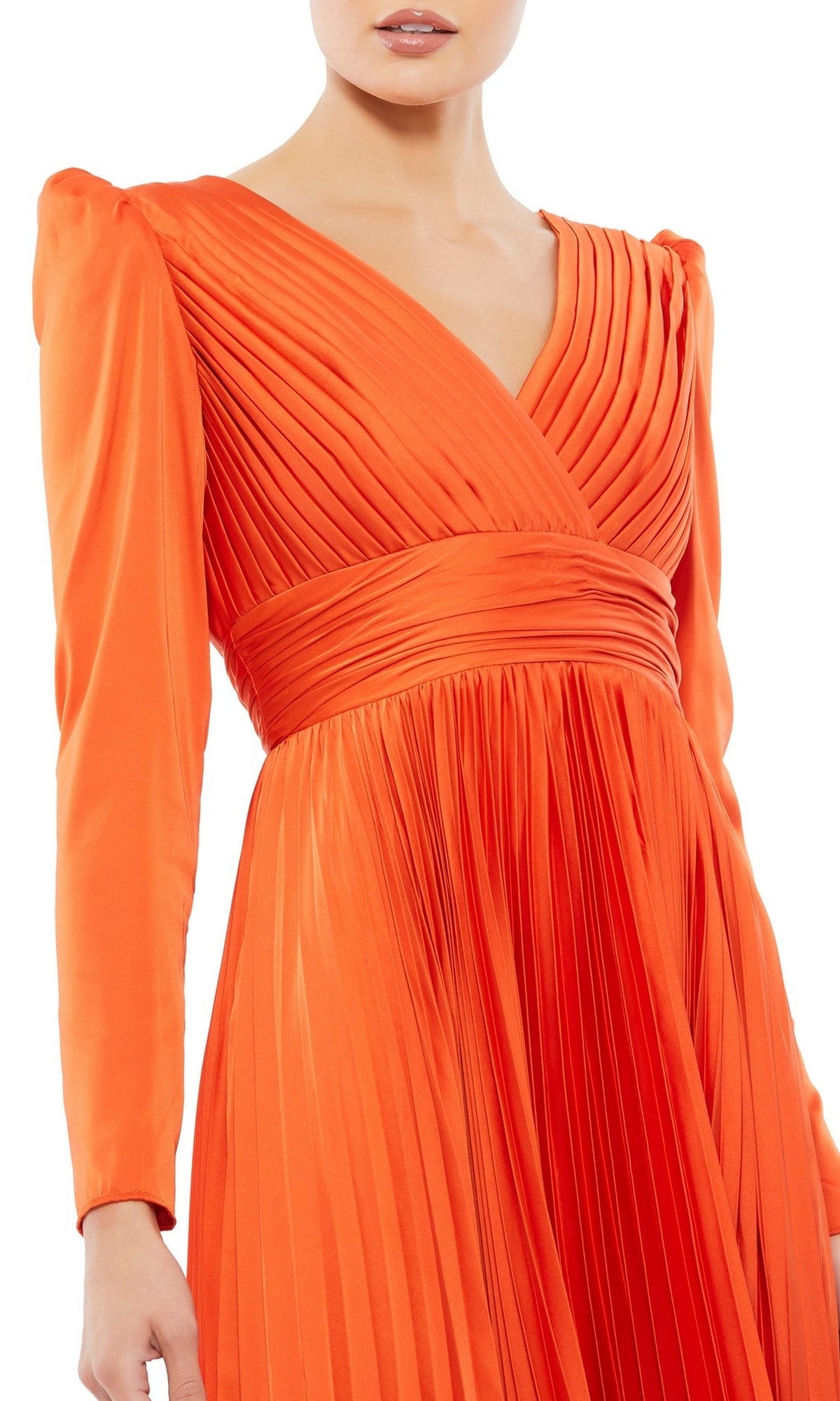 Woman wearing the Long Formal Dress 26542 by Mac Duggal, a bright orange, long-sleeved formal dress with pleats, a V-neckline, and fitted waist.