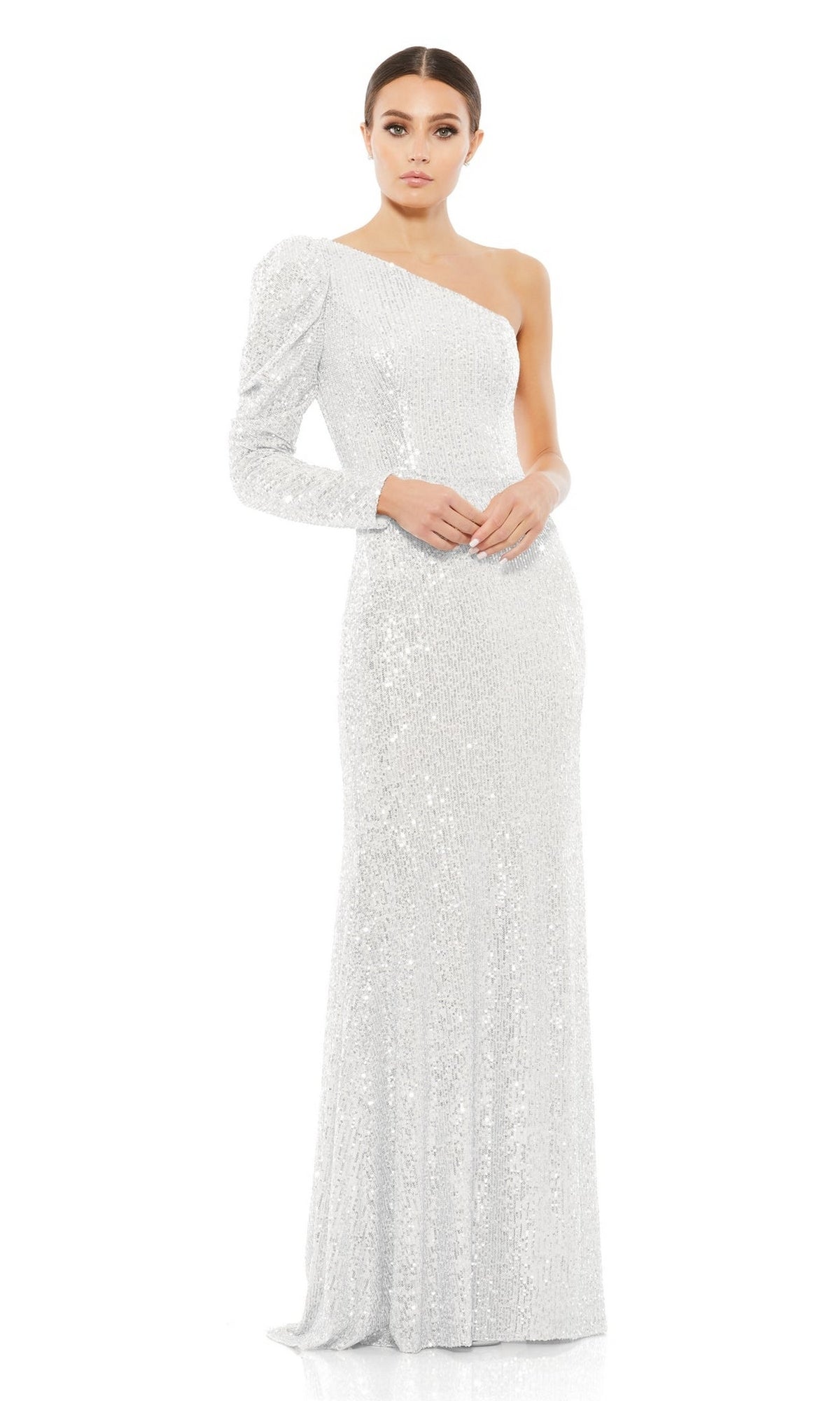 A woman stands against a white background wearing the Mac Duggal 26591 One-Sleeve Sequin Formal Dress, featuring an asymmetrical neckline.