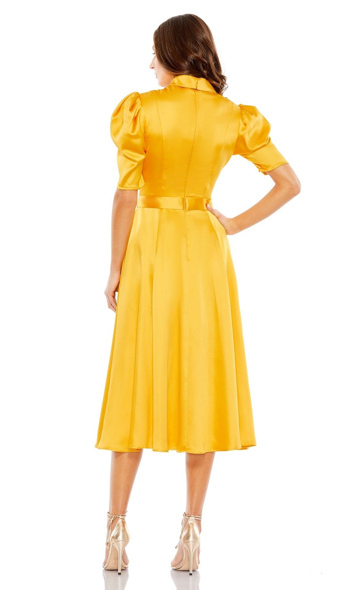 A woman stands with her back to the camera, wearing the Mac Duggal 2628 Short Sleeve Wedding Guest Dress—a yellow midi dress with a flared skirt and puffed shoulders.