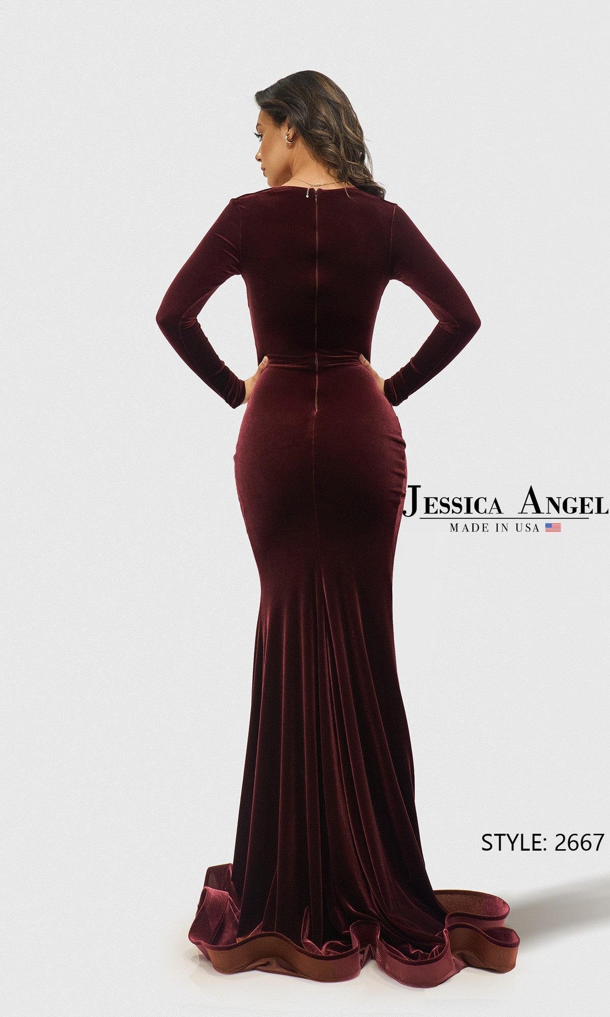 A woman models the fitted Long Prom Dress: Jessica Angel 2667, featuring burgundy velvet, long sleeves, and a train. She is shown from the back with the style name and number visible, highlighting this elegant prom dress.