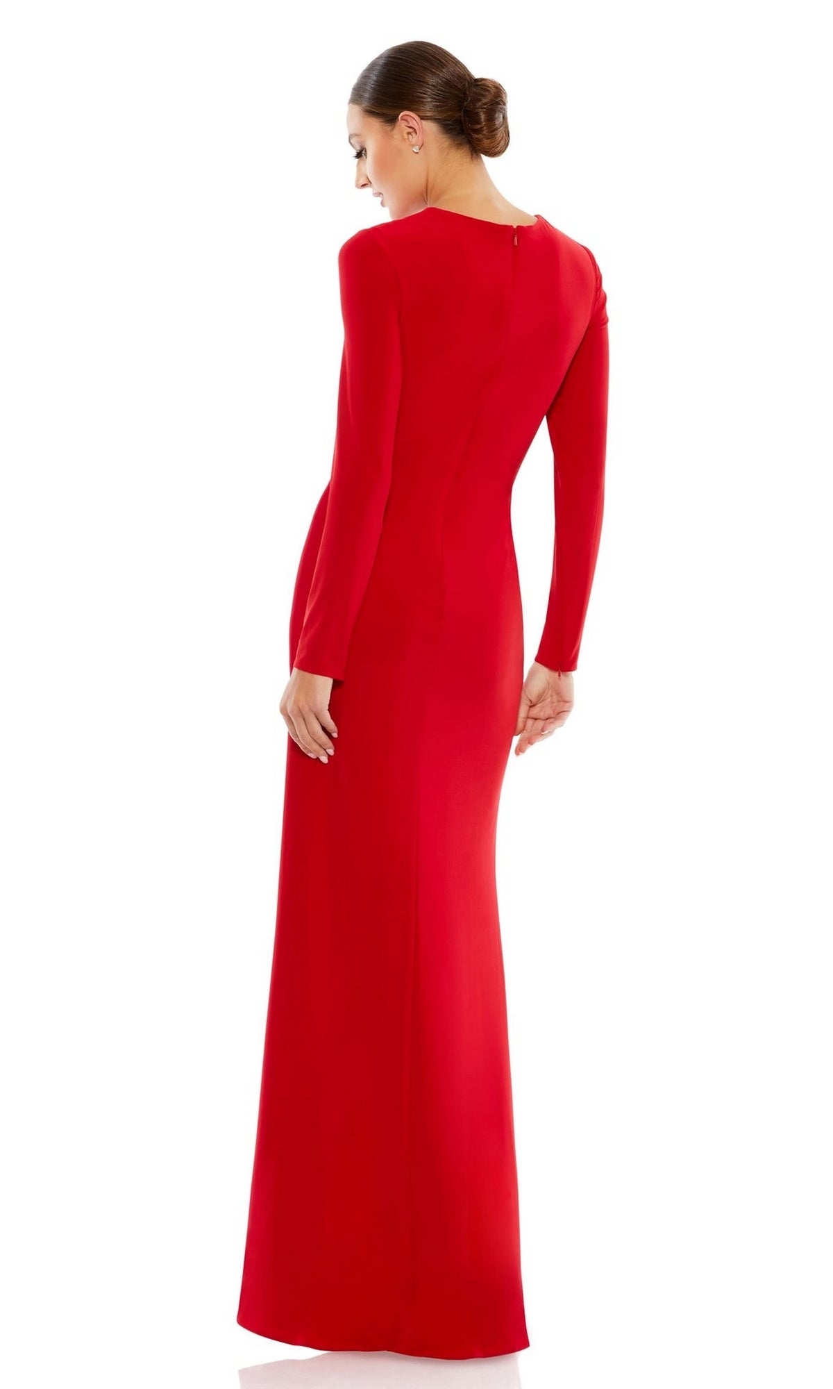 A woman in the Mac Duggal 26686 long sleeve long formal dress stands facing away with her head turned to the side and hair in a neat bun.