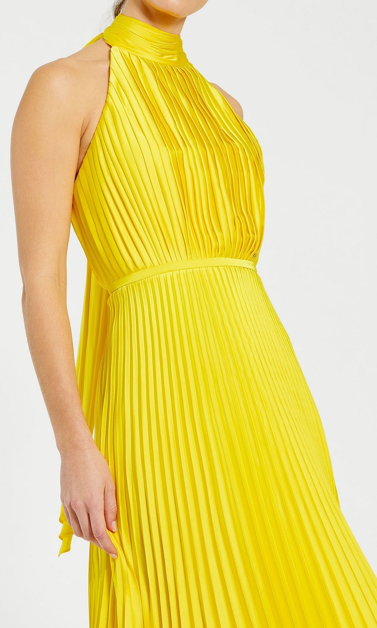 A person models the Tea Length Formal Dress 26909 by Mac Duggal in yellow, featuring a sleeveless, pleated design and high neckline, shown from shoulders to mid-thigh against a plain background.