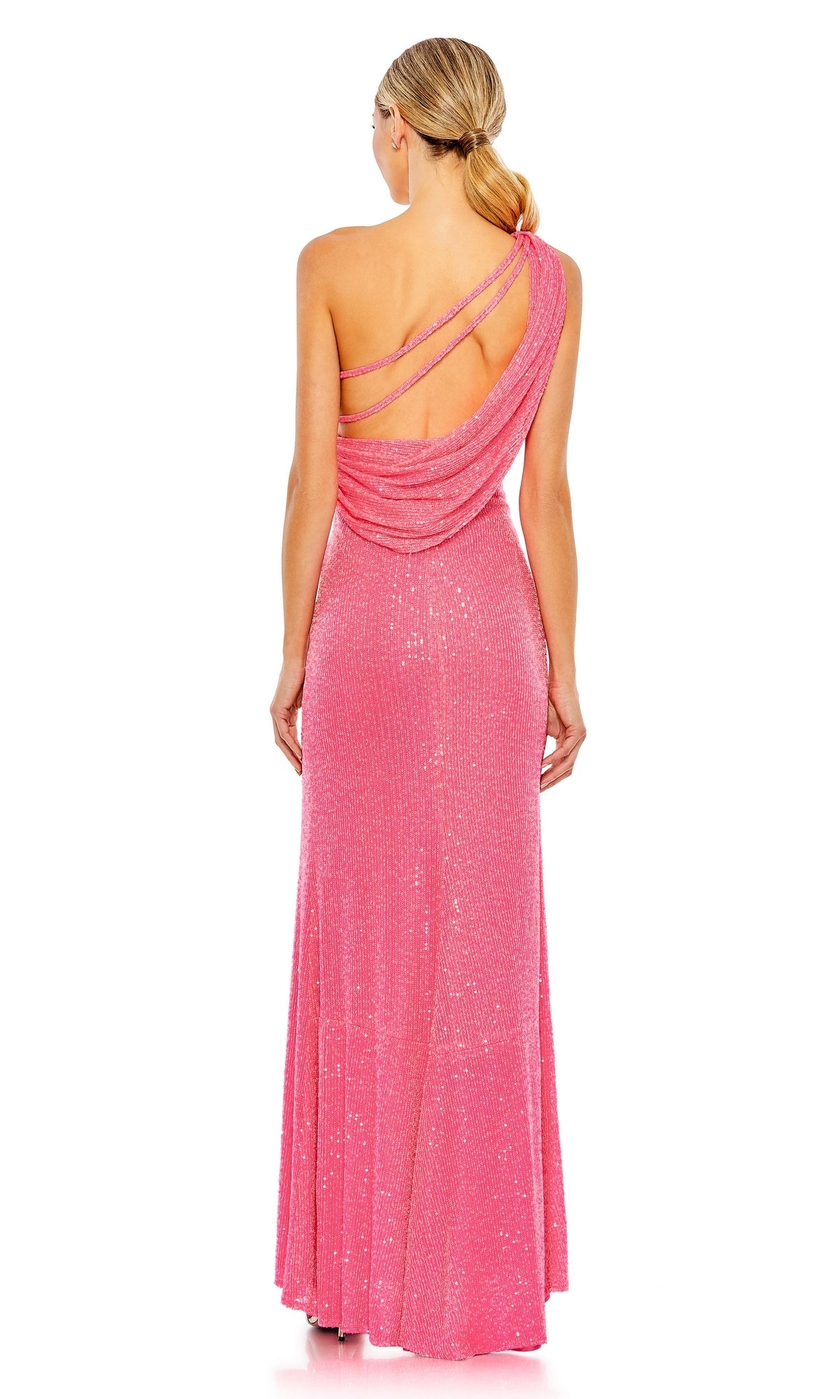 A woman faces away, wearing the Mac Duggal 26990 One-Shoulder Sequin Formal Gown—a long pink dress with draped details, one shoulder design, and two thin straps crossing her elegantly open back.