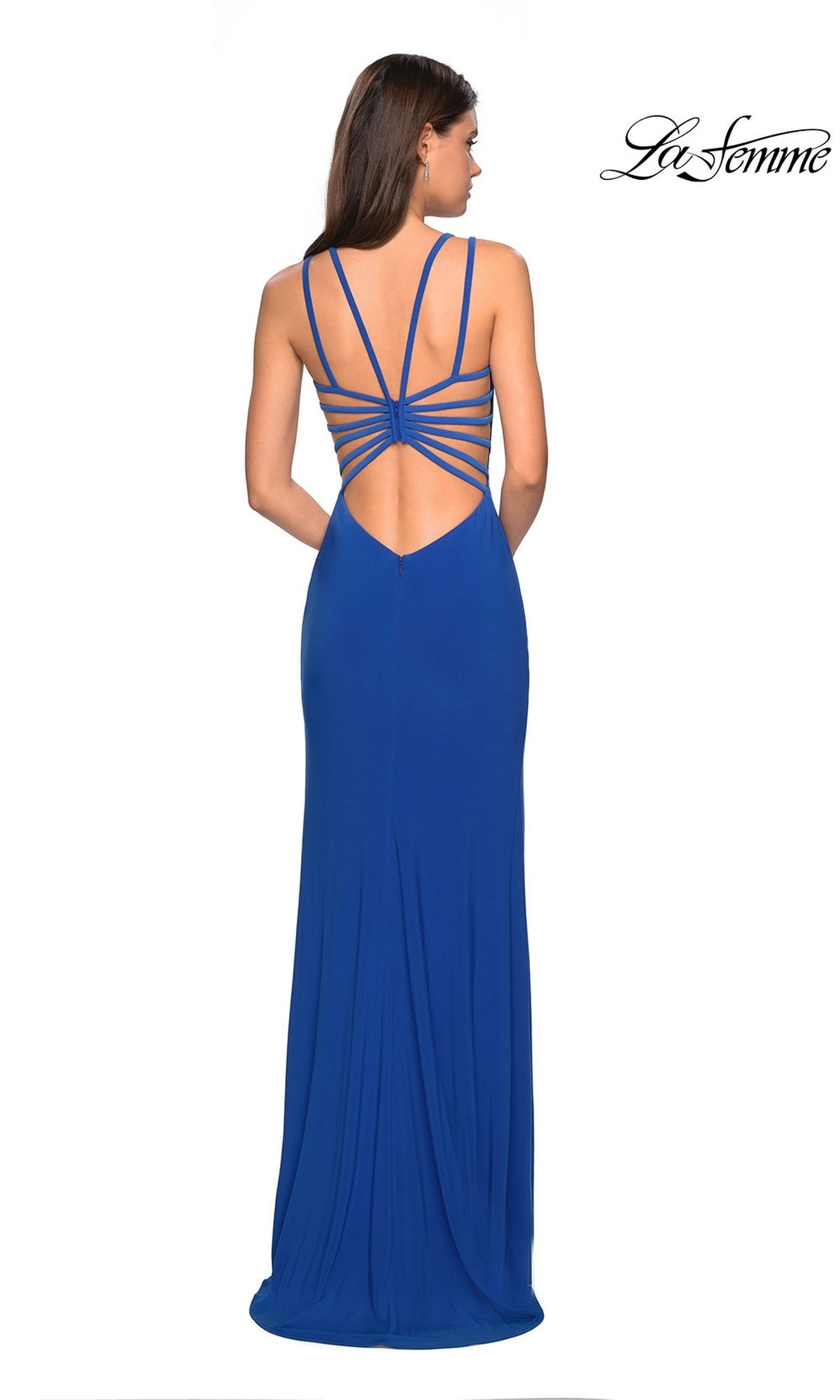 A woman stands facing away, wearing the La Femme Statement-Back Long Prom Dress 27072 in royal blue, featuring a long skirt and multiple thin straps across an open back.