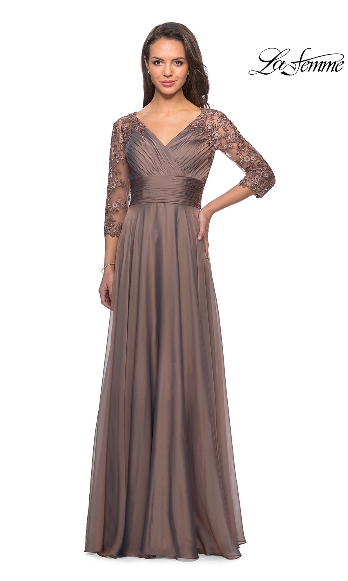 The La Femme 27153 is a long, mocha-colored chiffon formal dress featuring three-quarter-length lace sleeves and a pleated V-neck bodice, ideal for evening events.