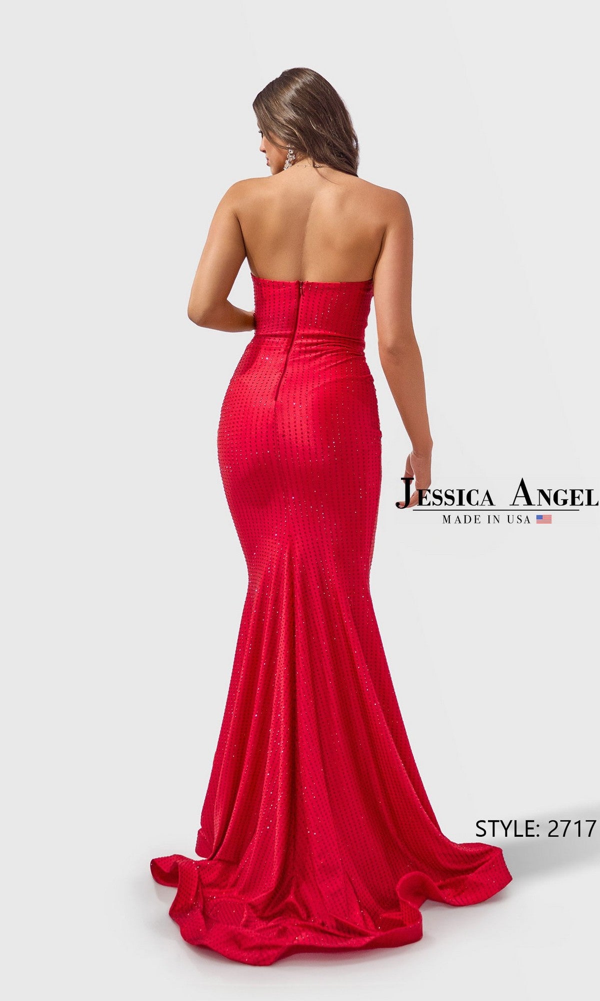 A woman stands with her back to the camera wearing the Jessica Angel 2717 long prom dress, a strapless gown with a sweetheart neckline and subtle sparkle. Text reads “Jessica Angel, Made in USA, Style: 2717.”.