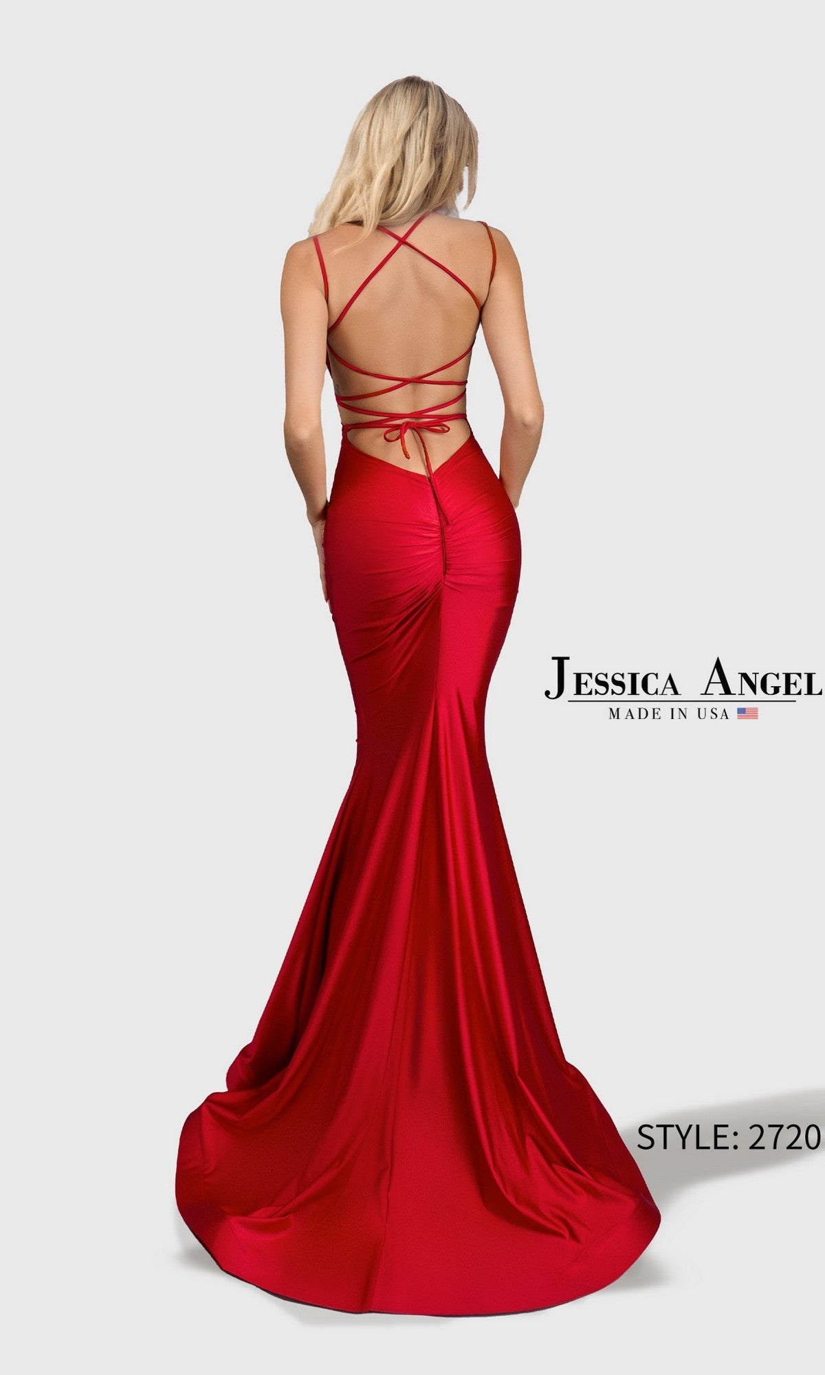 Woman in a floor-length, backless red mermaid gown with crisscross straps and fitted bodice. Text: