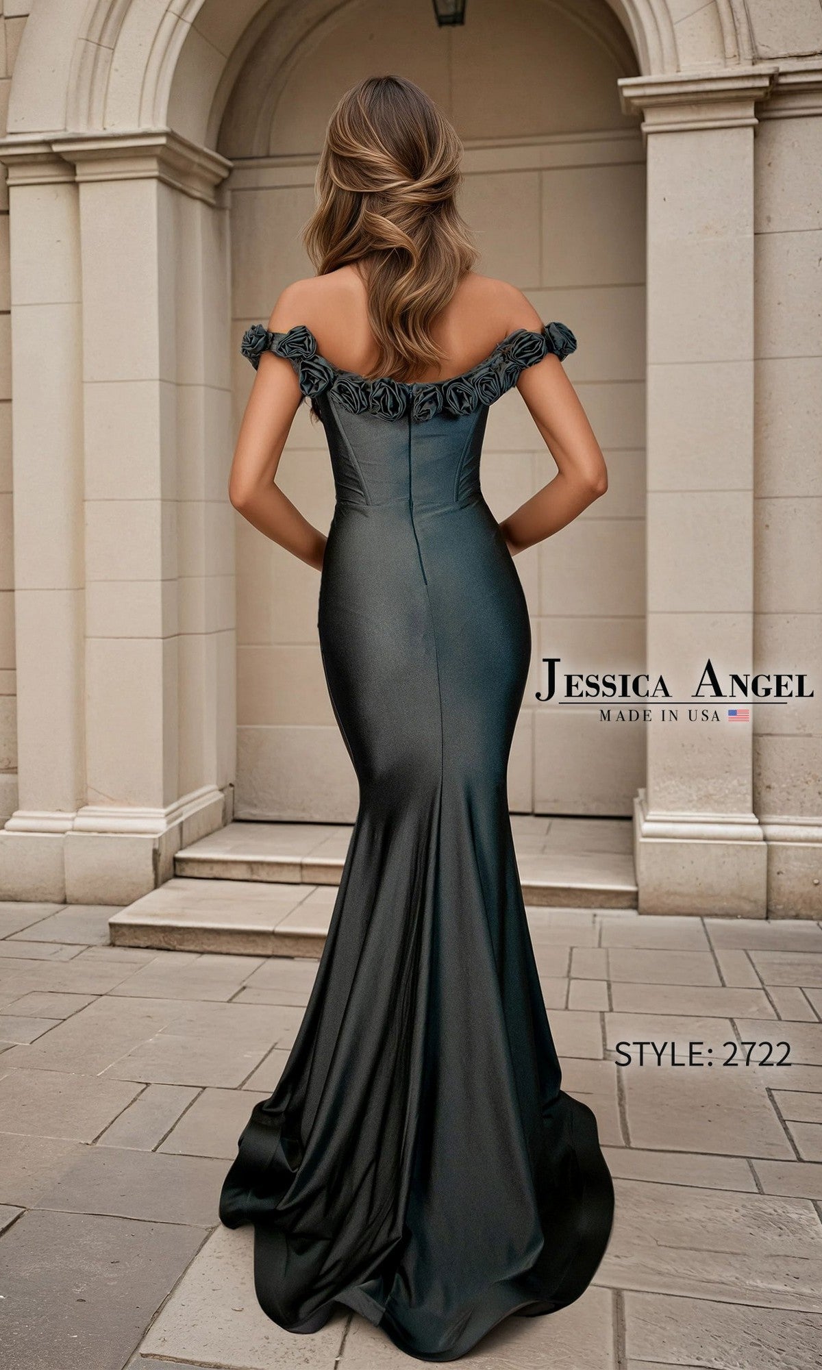 A woman in the Jessica Angel 2722 Long Prom Dress, featuring a fitted off-the-shoulder mermaid silhouette, stands outside a stone building.