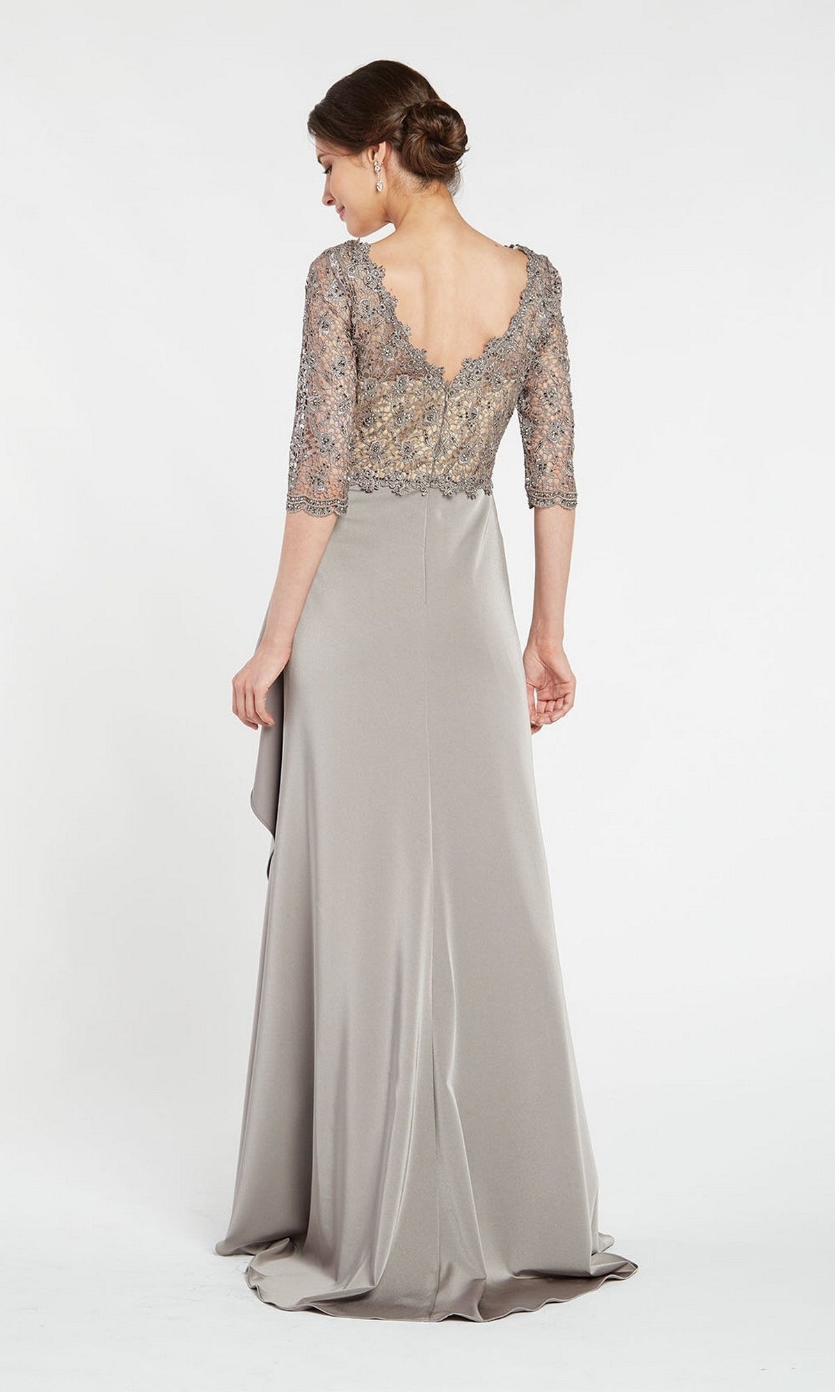 A woman wearing the Alyce 27260 long formal dress poses with her back to the camera, featuring a silver floor-length lace bodice against a plain white background for an elegant mother-of-the-bride look.