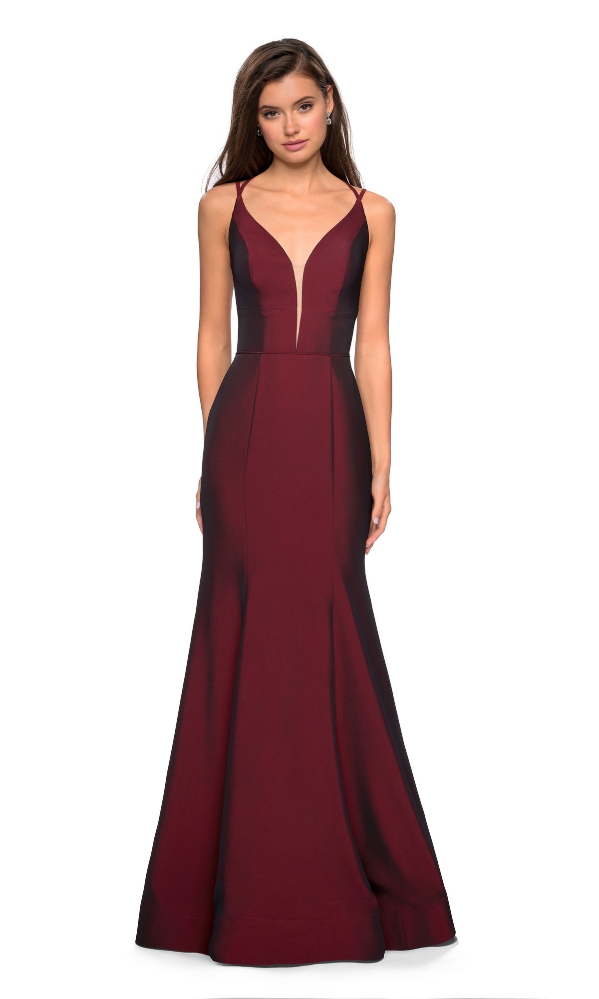 A woman models the La Femme Open-Back V-Neck Jersey Prom Dress 27446, featuring a sleeveless mermaid silhouette with double spaghetti straps, a fitted bodice, flared hem, and open back, against a white background.