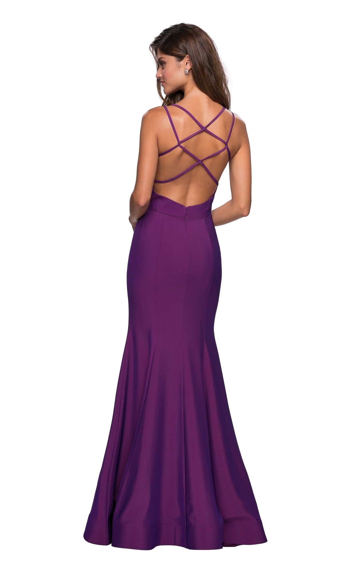 A woman poses against a white background wearing the La Femme Open-Back V-Neck Jersey Prom Dress 27446, a floor-length purple mermaid gown with double spaghetti straps and an open back.
