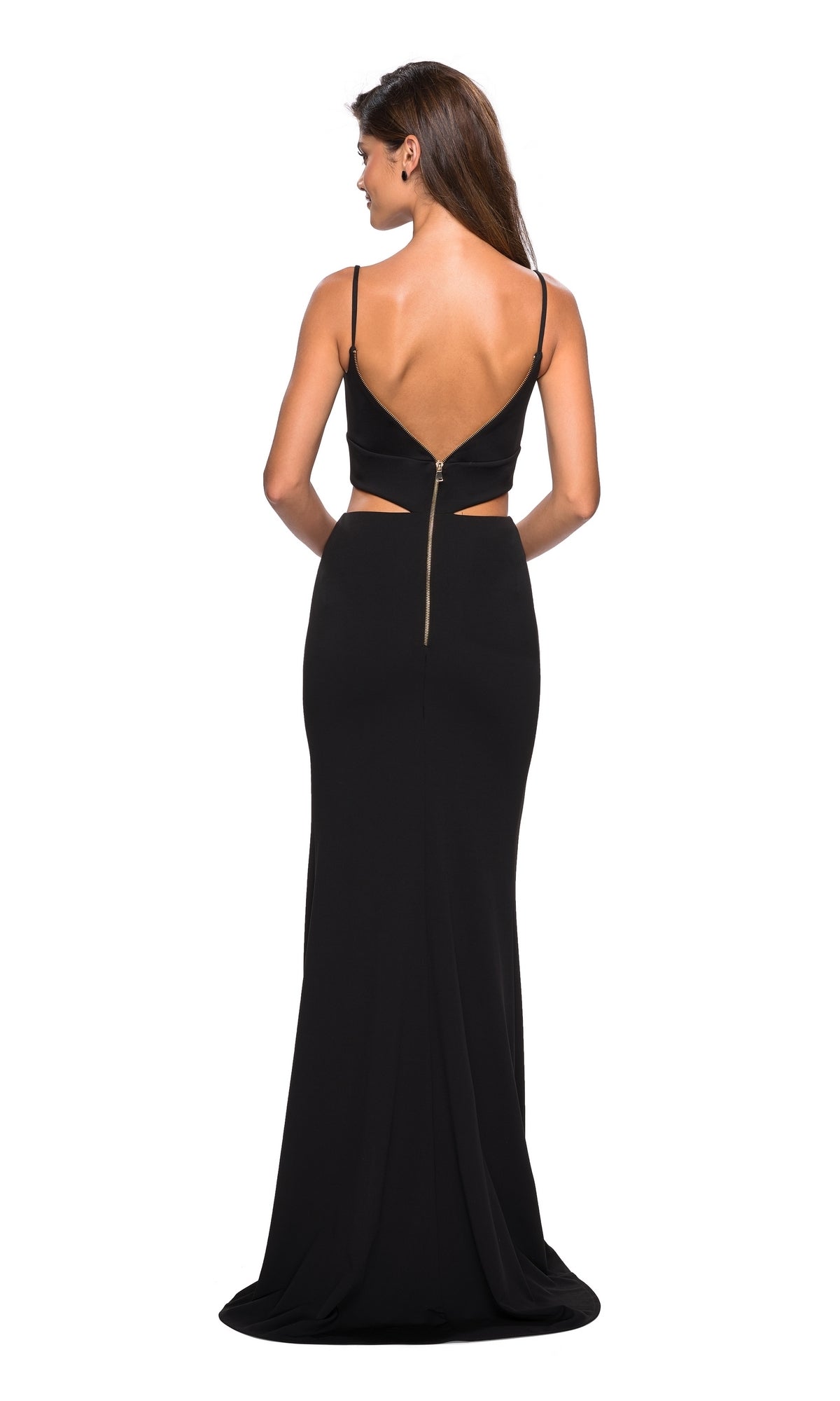 Woman in the La Femme 27453 Mock-Two-Piece Black Prom Dress with thin straps, low back, waist cutout, and visible back zipper, standing and facing away from the camera.