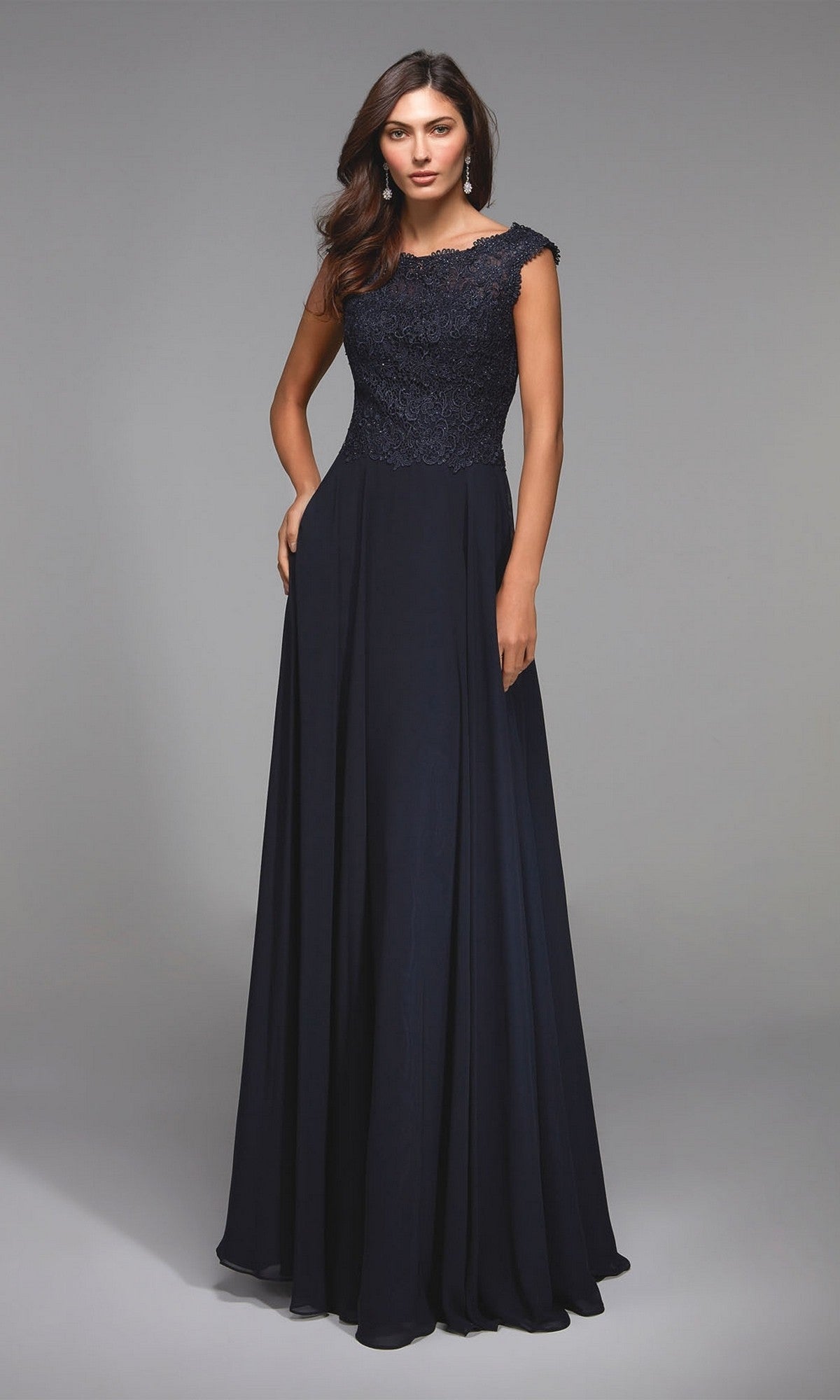 A woman models the Alyce 27504, a sleeveless midnight chiffon formal dress with a lace bodice and flowing floor-length a-line skirt, standing against a plain gray background.