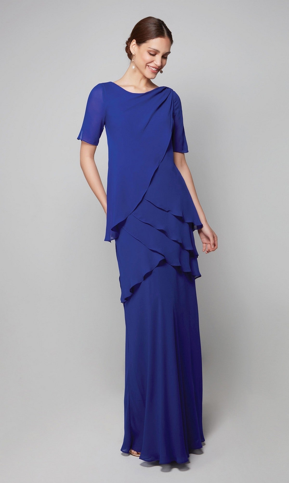 A woman models the Alyce 27593, a long royal blue chiffon gown with tiered layers and short sleeves—an elegant mother-of-the-bride formal dress against a neutral background.