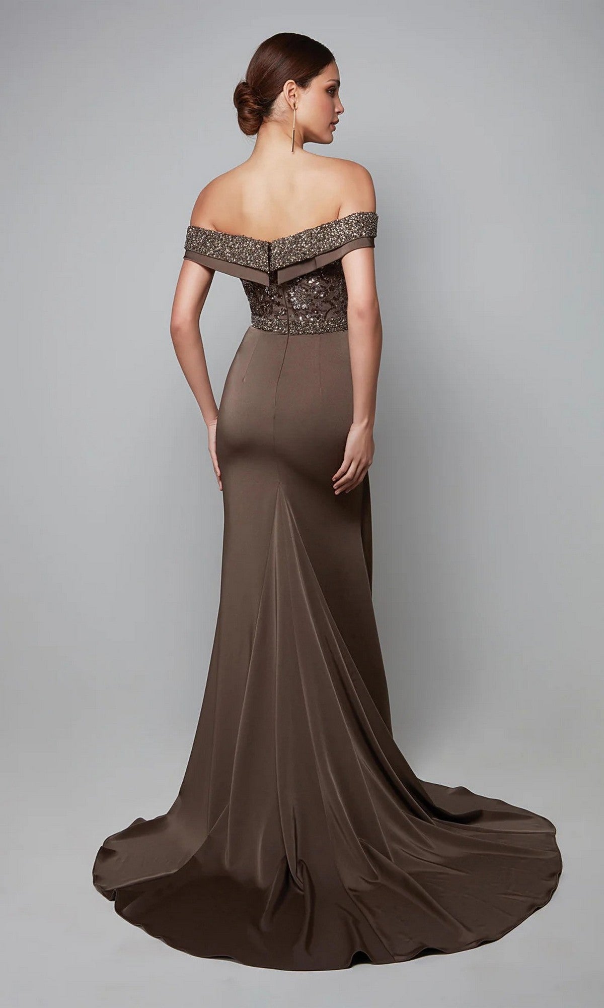 Woman in the Alyce 27619 long formal dress with an off-the-shoulder beaded bodice and flowing train, posing against a plain gray background—the perfect sophisticated mother-of-the-bride dress.