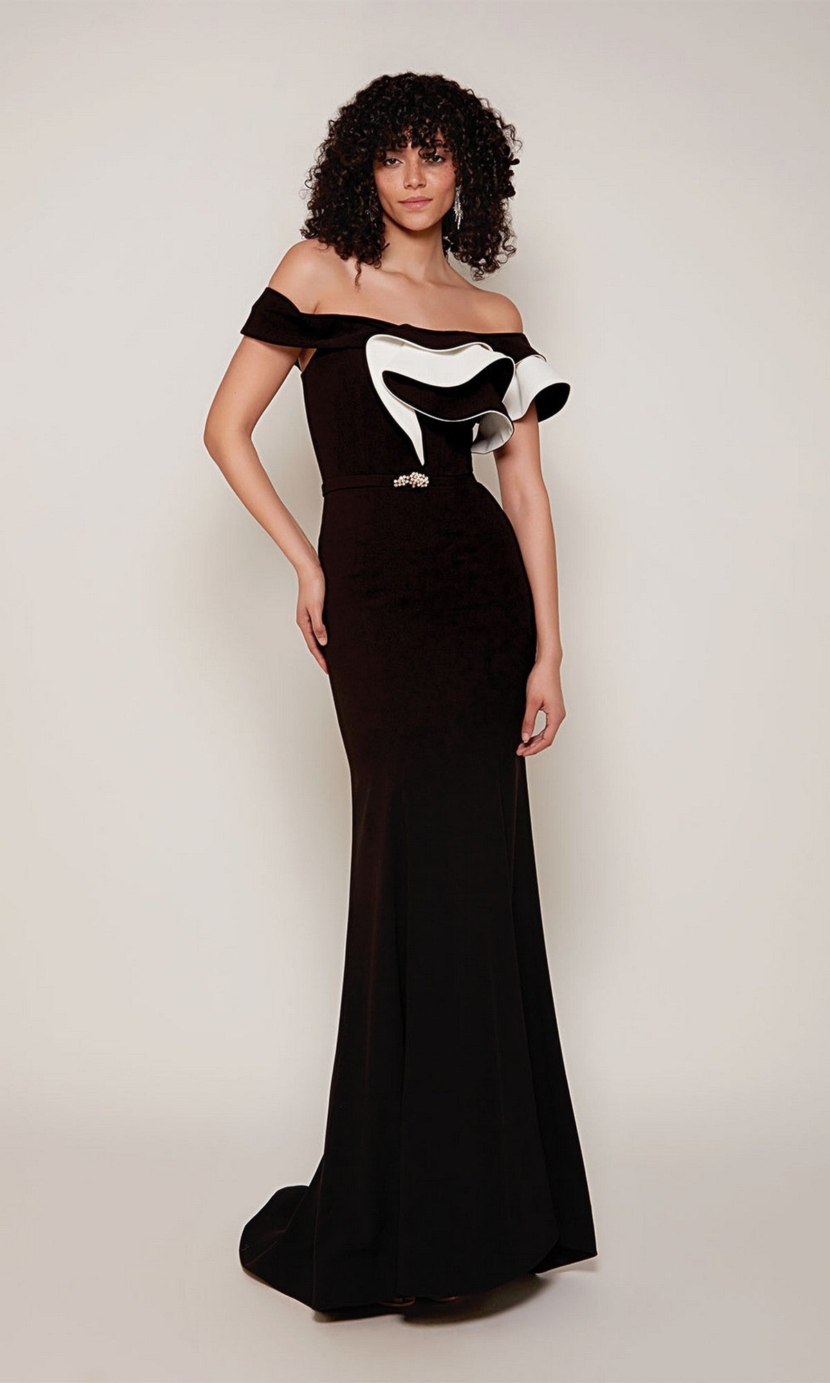 A woman models the Alyce 27672 long formal dress—an off-the-shoulder black sheath with a two-tone ruffle—against a plain background.