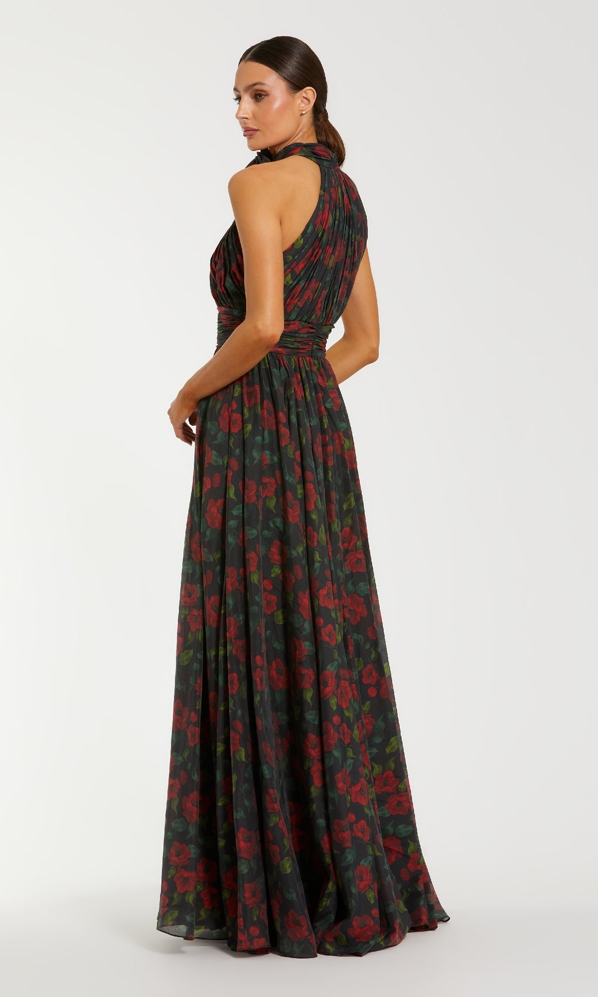 Woman wearing a floral patterned dress on a white background