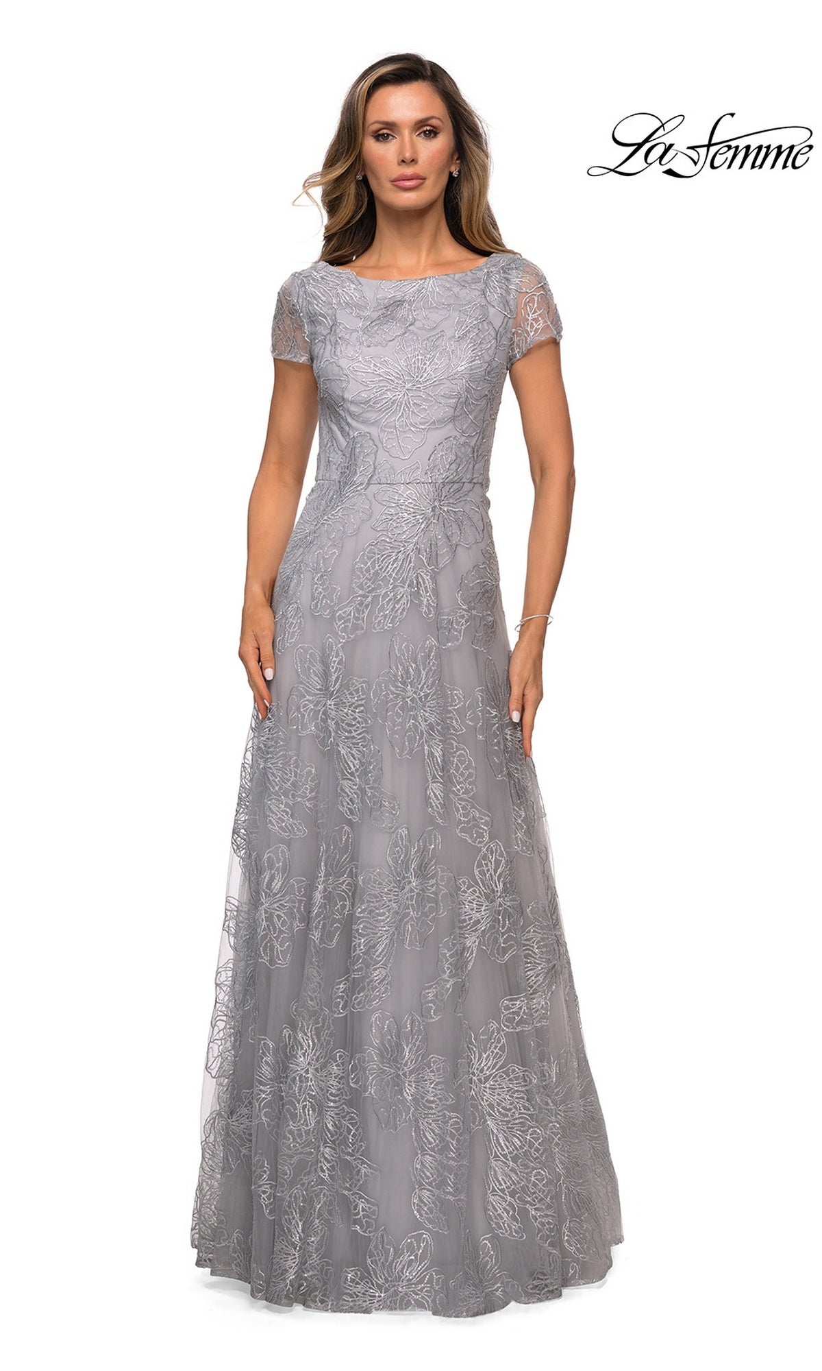 La Femme 27837 silver cap-sleeve floor-length evening gown featuring a floral embroidered overlay.