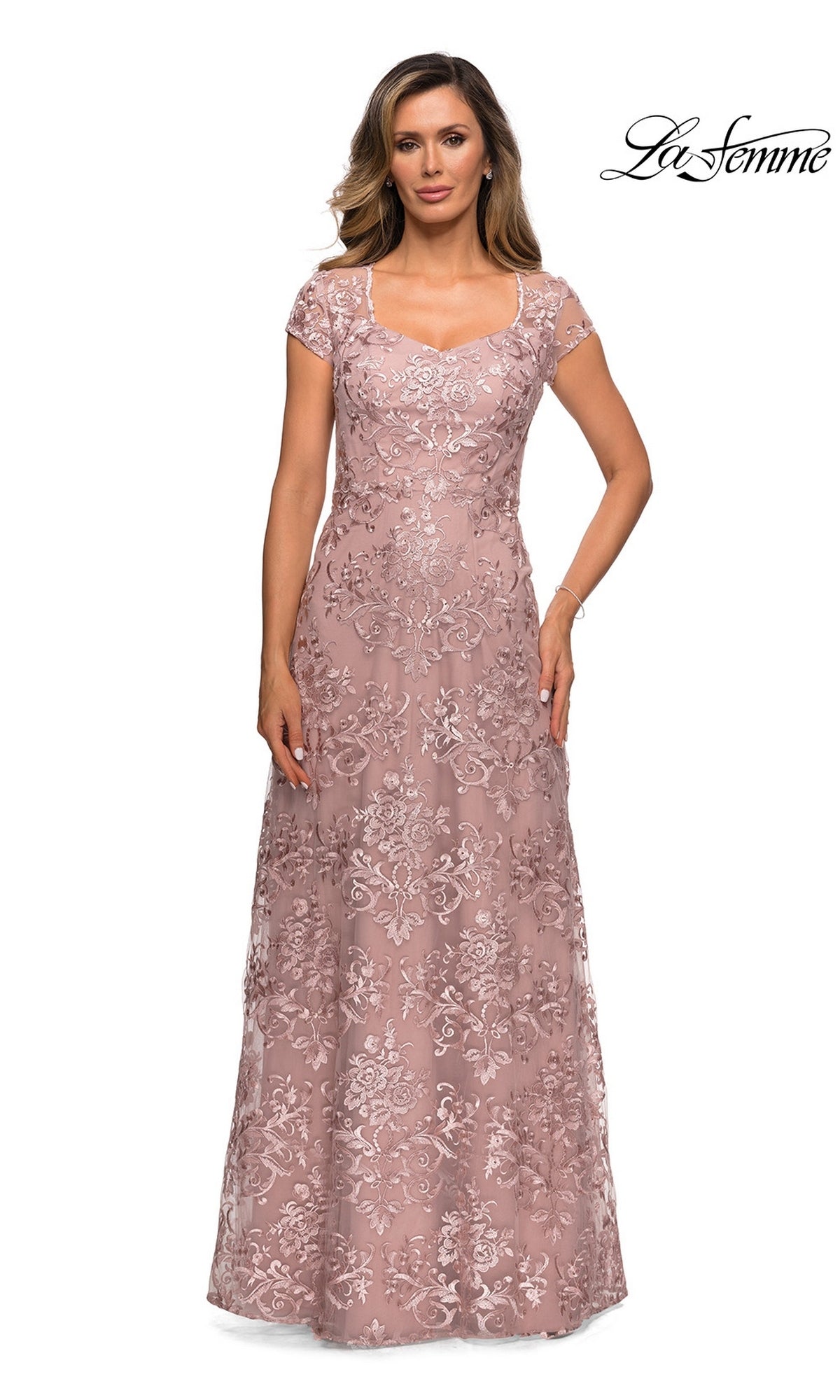A woman wearing a mauve La Femme 27951 floor-length formal dress with a sweetheart neckline, cap sleeves, and all-over floral lace embroidery.