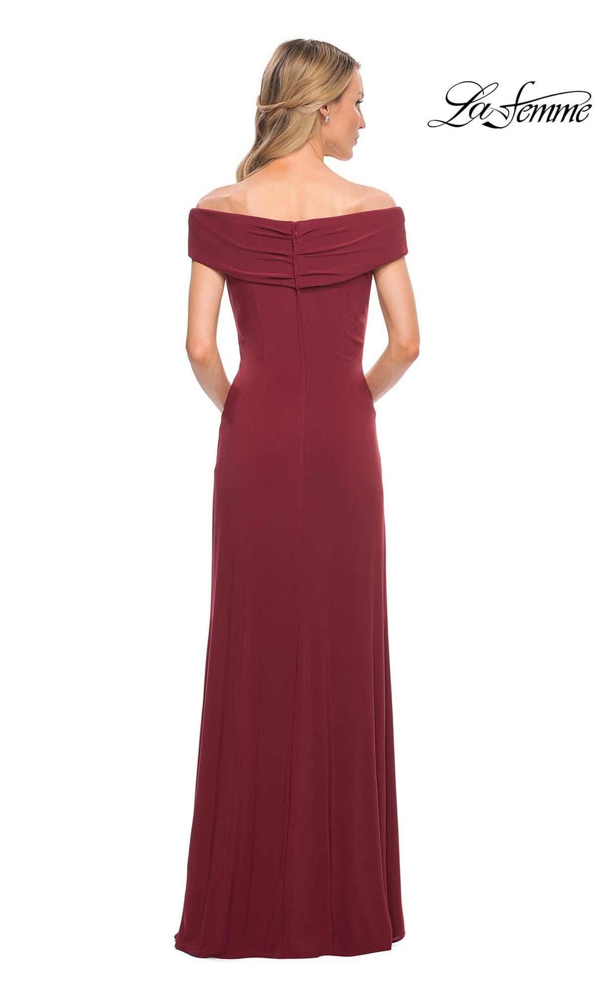 Woman facing away, wearing the Long Formal Dress: La Femme 27959—an off-shoulder, floor-length burgundy jersey gown. “La Femme” logo in corner.
