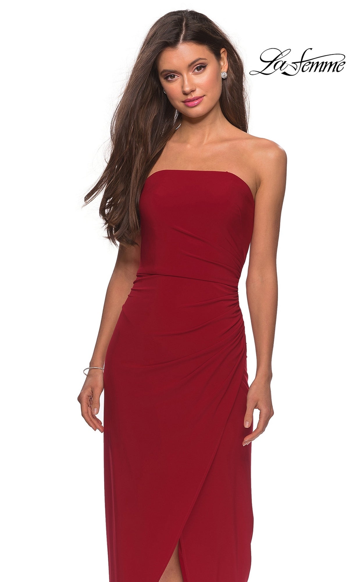 Woman wearing Long Prom Dress: La Femme 28204—strapless, with a ruched bodice and fitted sheath skirt—stands against a white background. “La Femme” logo is in the top right.