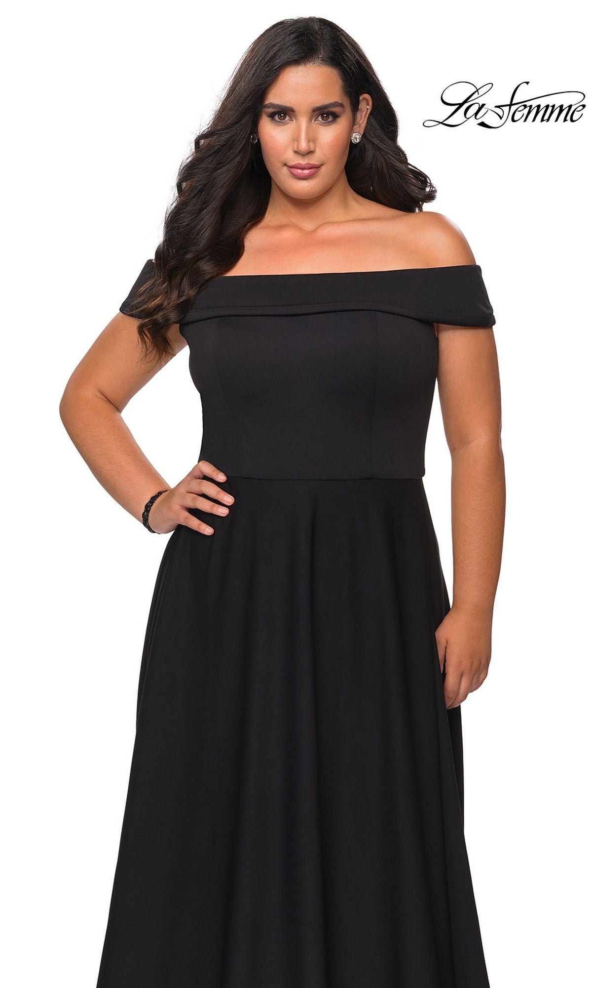 Woman wearing the Long Plus-Size Prom Dress: La Femme 29007 with a fitted bodice and flowing skirt, standing against a white background. “La Femme” logo in top right corner.