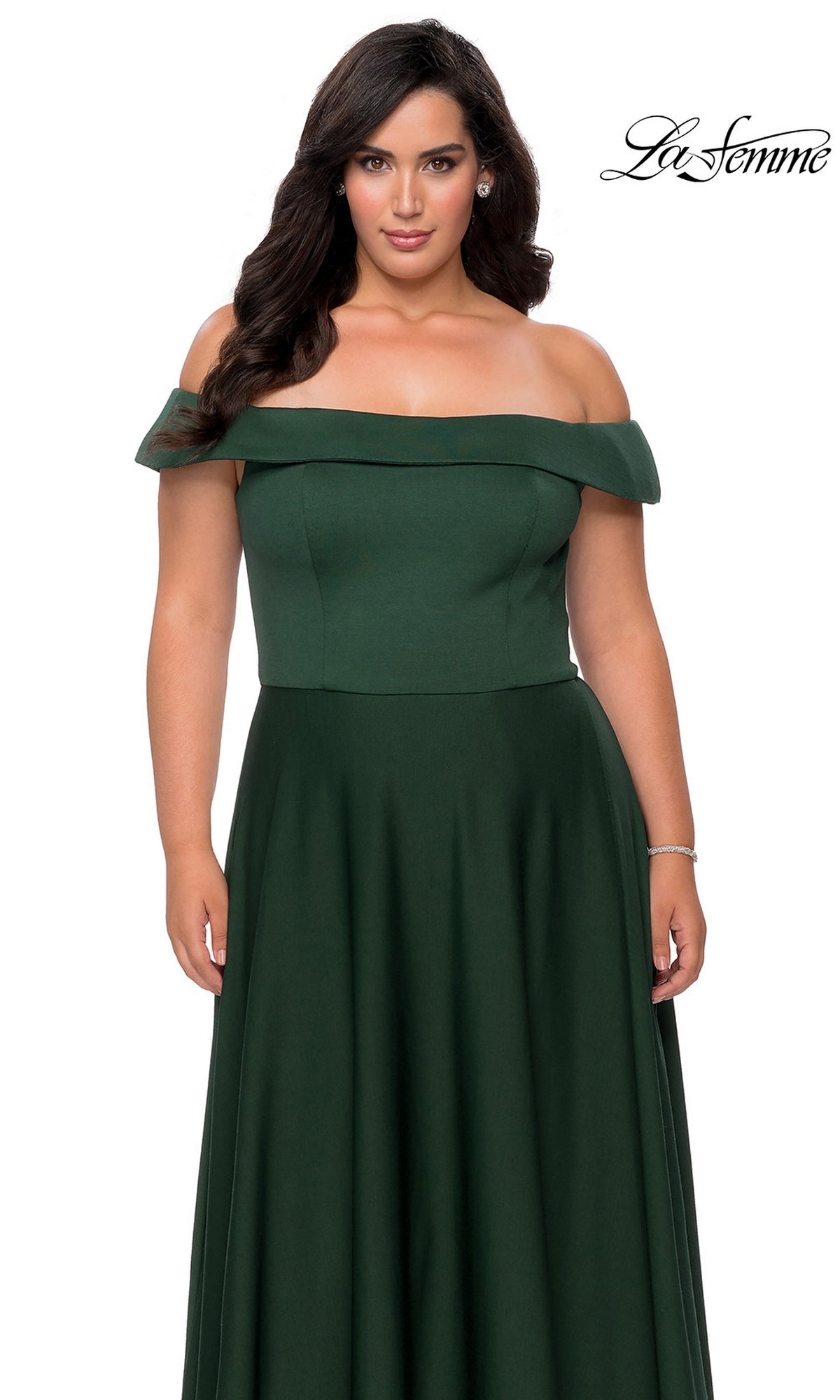 A woman models the Long Plus-Size Prom Dress: La Femme 29007 in floor-length dark green, off-the-shoulder, against a white background with the “La Femme” logo top right.