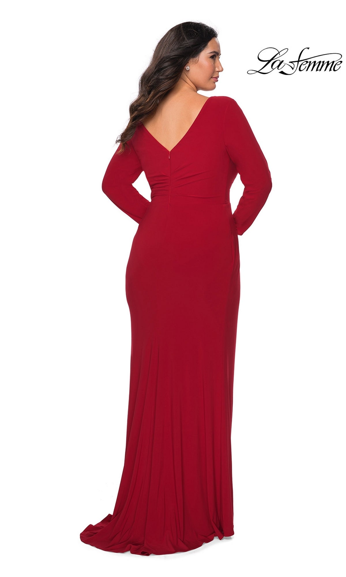 Back view of a woman in a Long Plus-Size Prom Dress: La Femme 29044, a floor-length, long-sleeve red dress featuring a faux wrap bodice and a V-neckline.