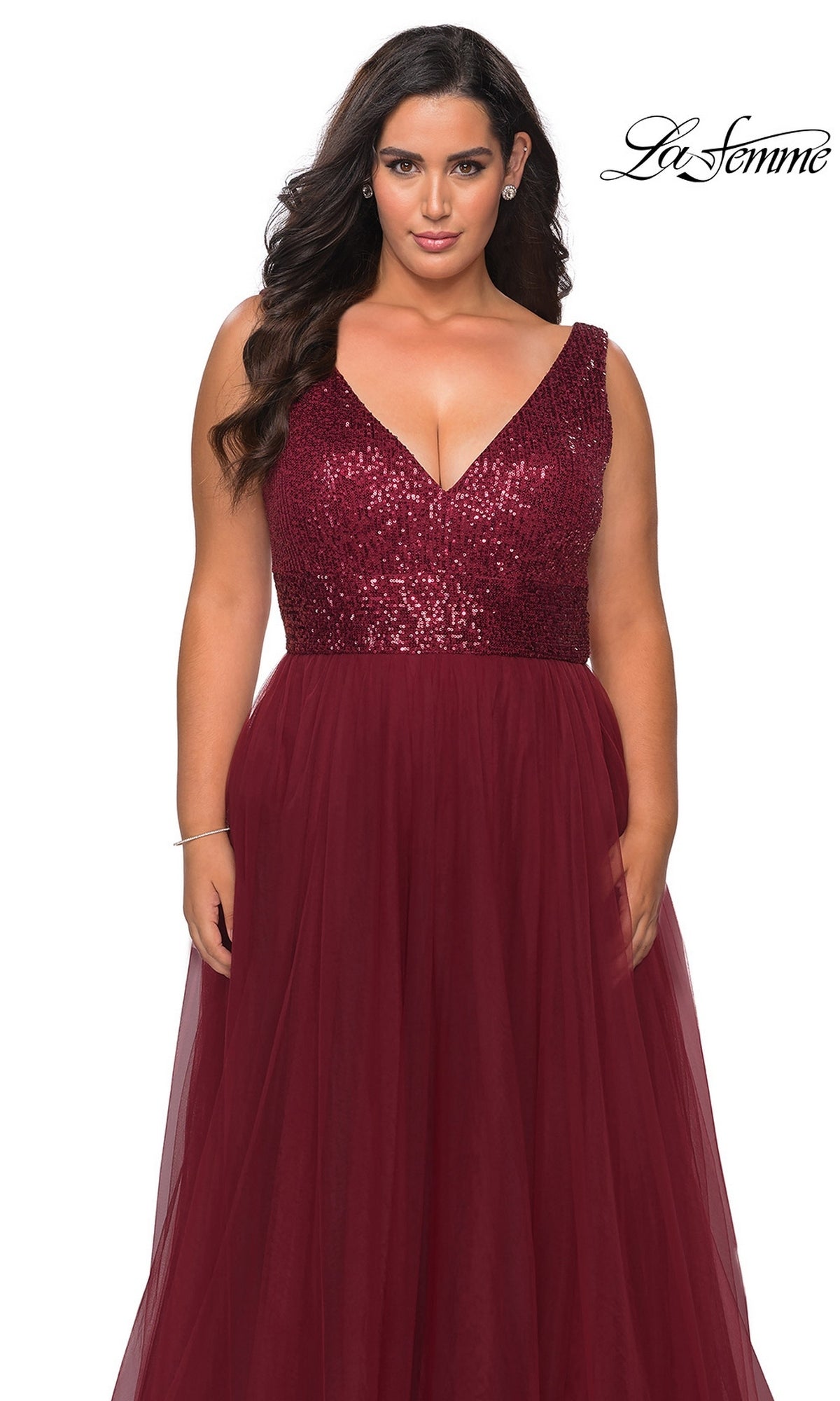 Woman in Long Plus-Size Prom Dress: La Femme 29045—sleeveless, burgundy, with sequin bodice & tulle A-line skirt. “La Femme” logo in top right on white background.