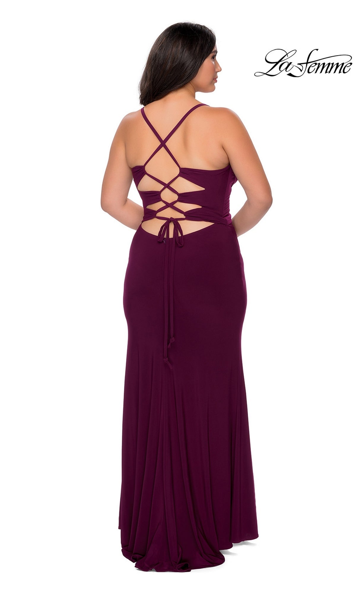 Back view of the Long Plus-Size Prom Dress: La Femme 29055, a floor-length, deep purple jersey gown featuring a lace-up back and thin straps.