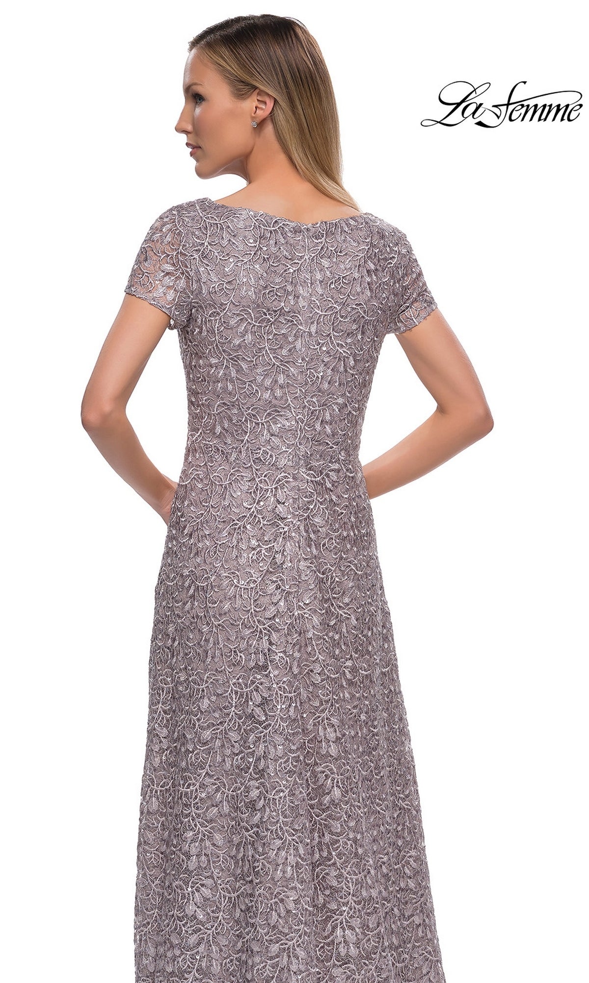 Back view of a woman wearing a La Femme 29198, a short-sleeved, floor-length dark mauve lace formal dress with intricate embroidery.