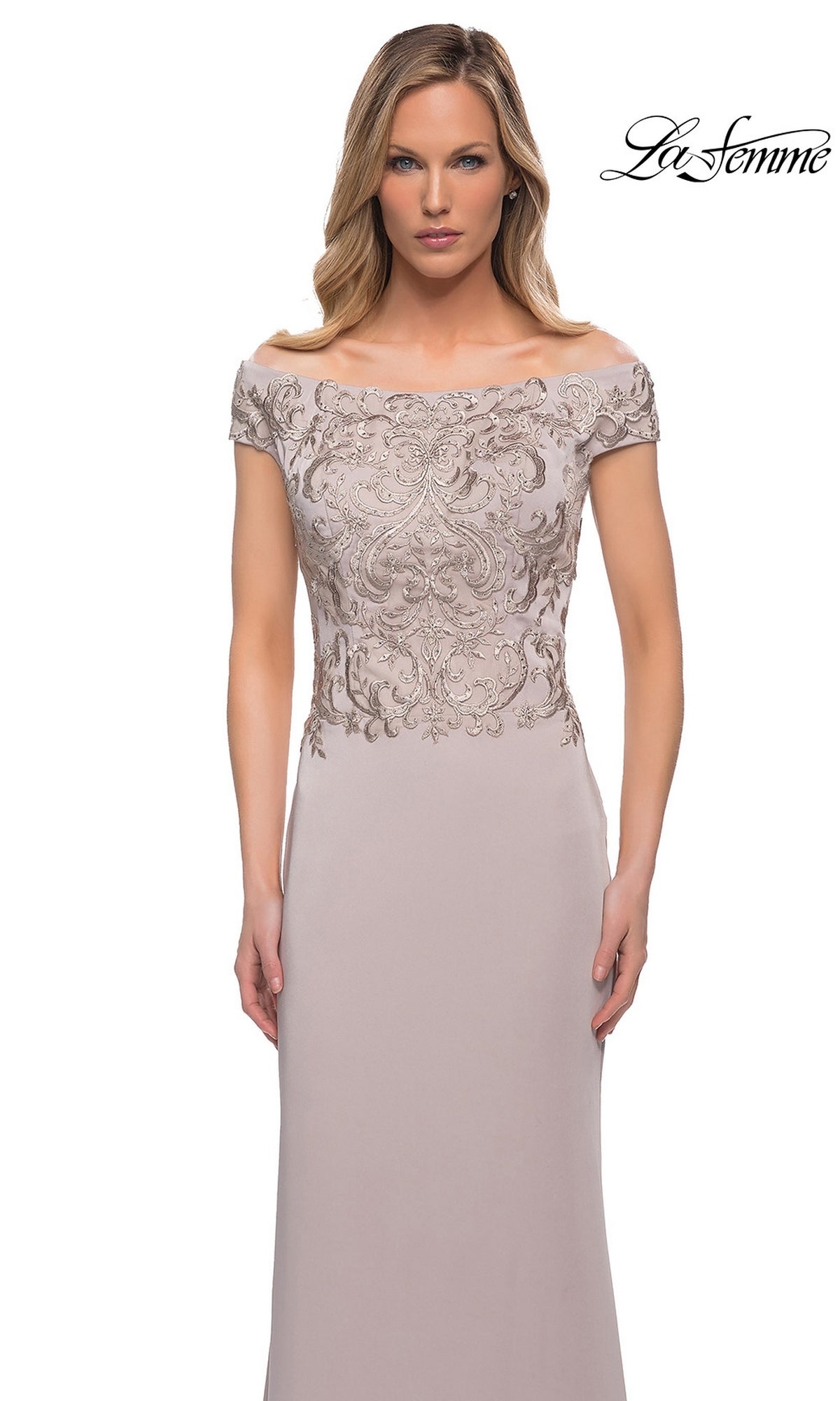 Woman in Long Formal Dress: La Femme 29331, featuring a taupe hue, fitted embroidered bodice, and off-the-shoulder neckline against a white background.
