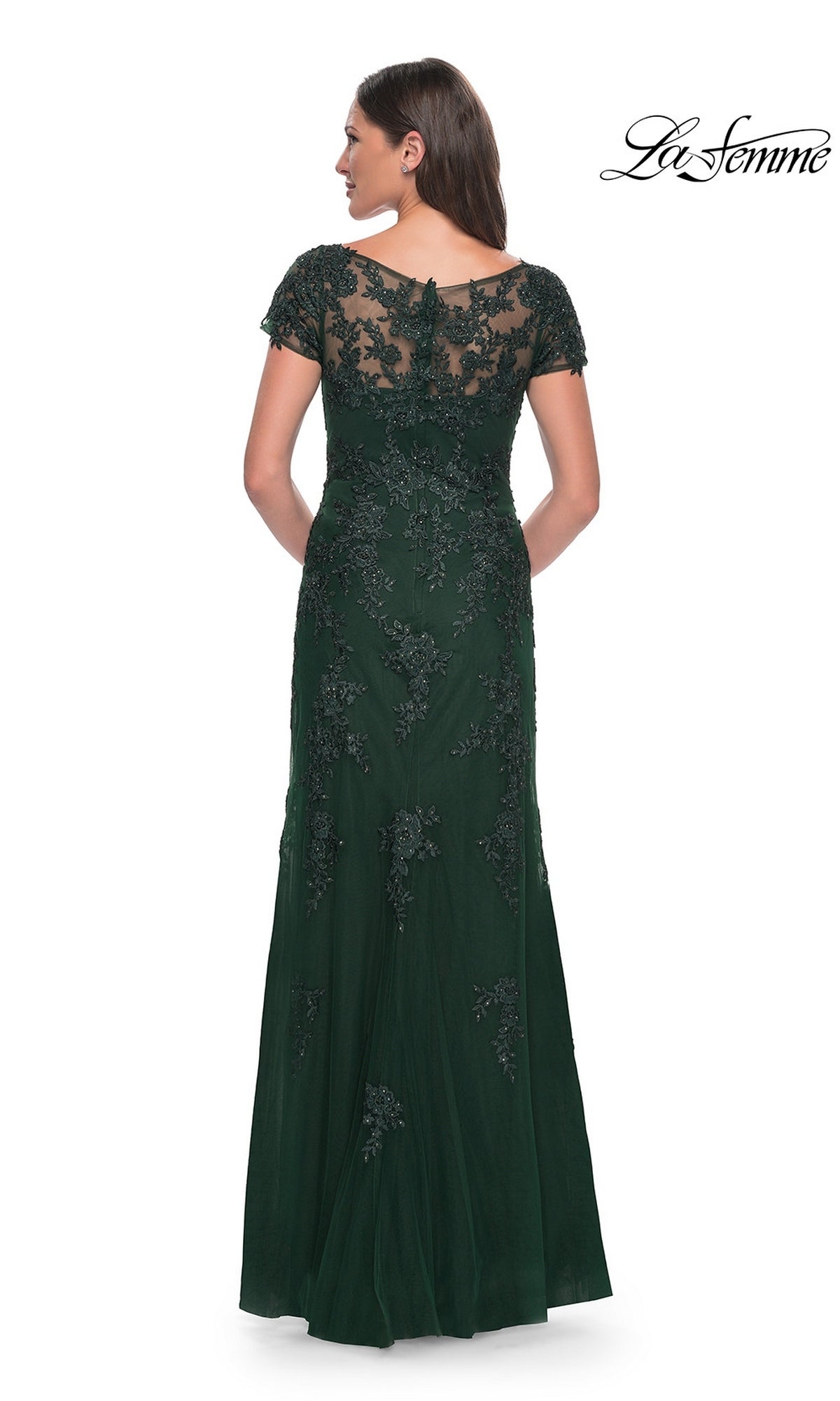 Back view of a woman in a Long Formal Dress: La Femme 29792, a modest, floor-length dark green gown with cap sleeves and intricate beadwork embroidery on the bodice and skirt.