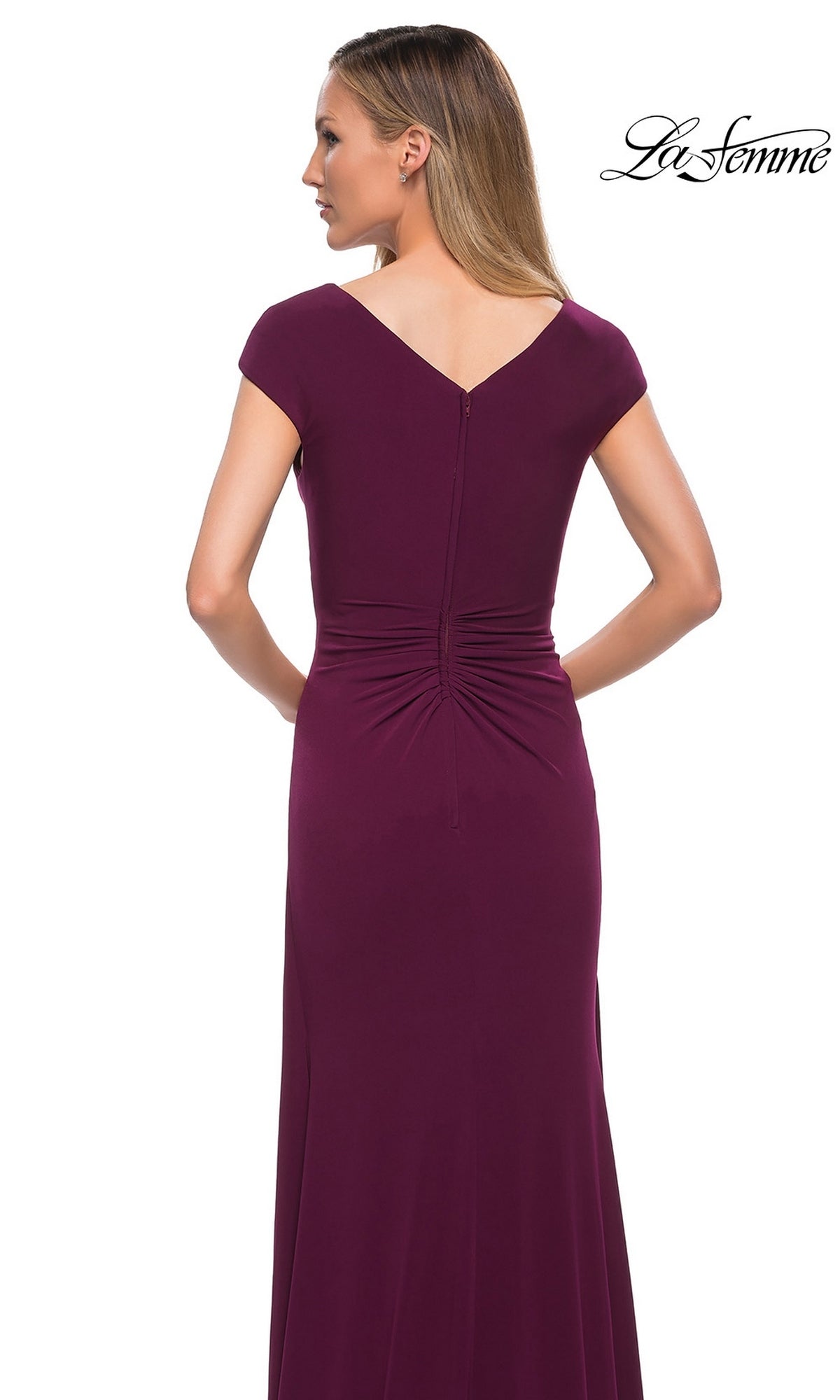A woman seen from the back wearing a deep purple Long Formal Dress: La Femme 29814 floor-length gown with cap sleeves, a gathered waist, and a cascading ruffle.