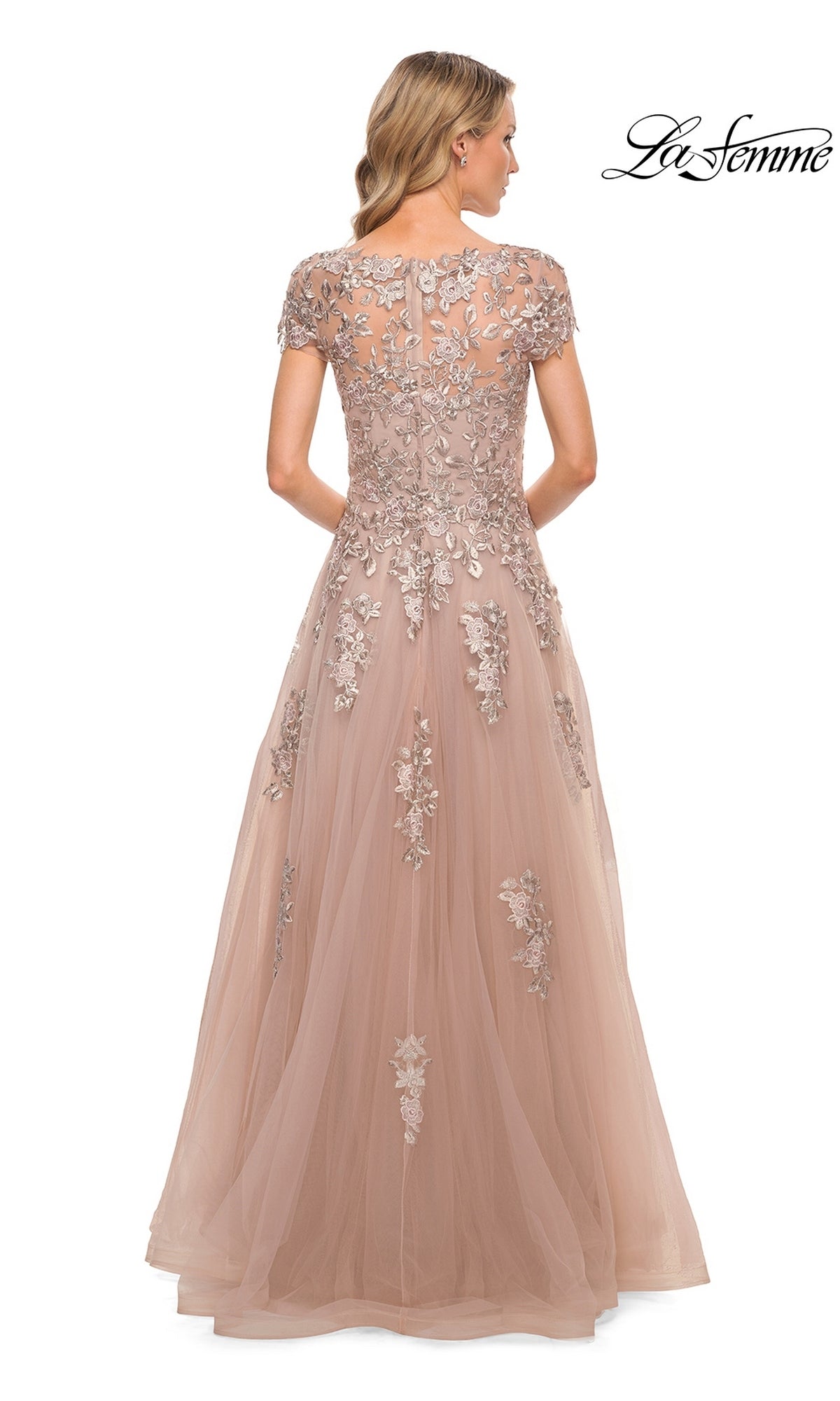 Back view of a floor-length dusty rose La Femme 29829 formal dress with cap sleeves and floral lace appliques on the bodice and skirt.
